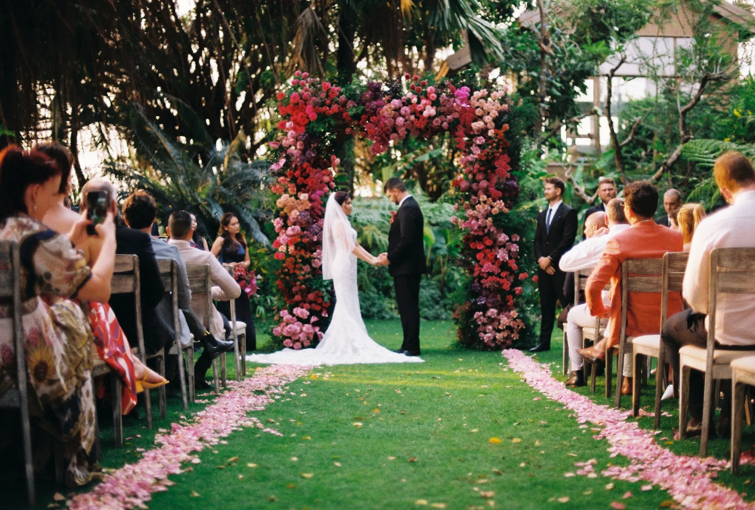 A lush garden ceremony at An Lam Retreats on the Saigon River, shot on film.