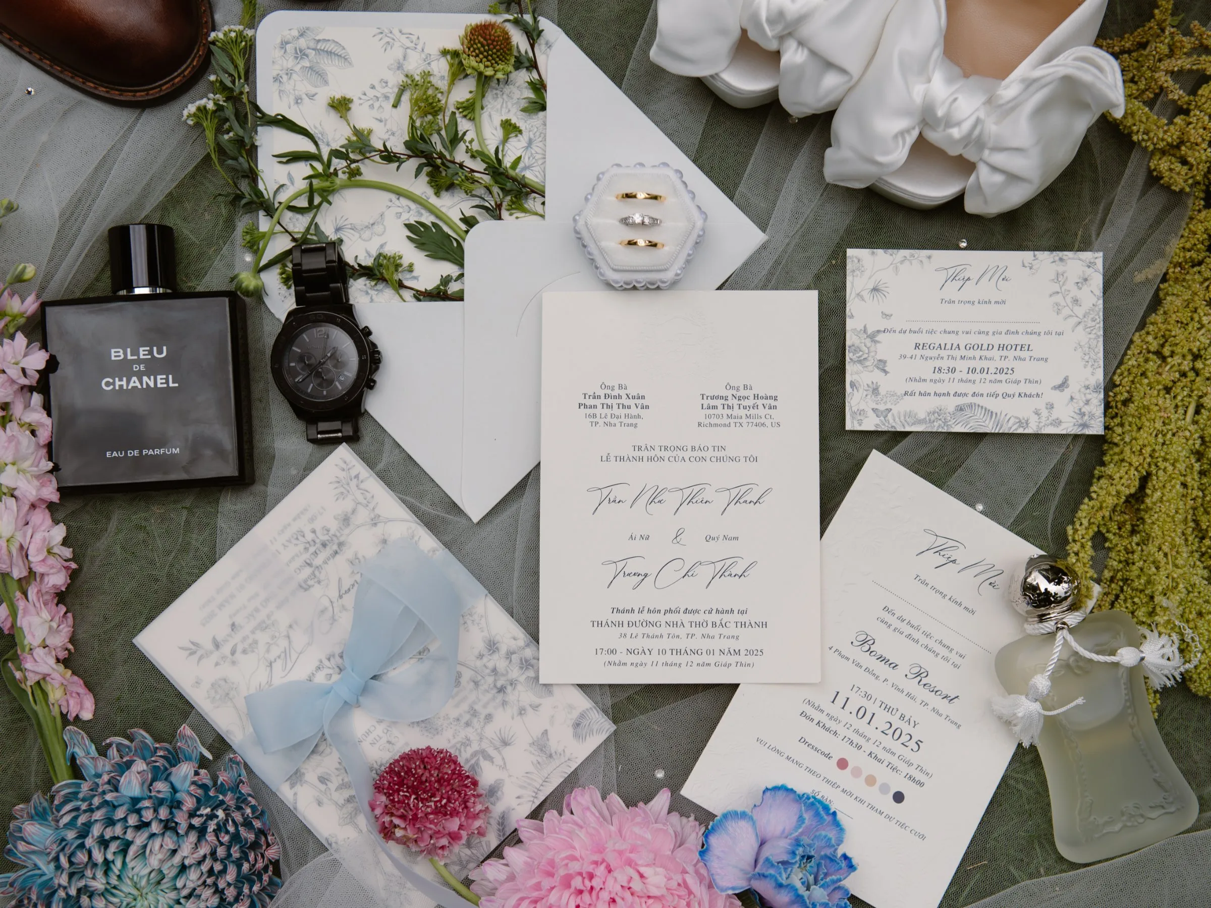 Wedding stationery, rings and flowers flat-lay at a Nha Trang beach wedding
