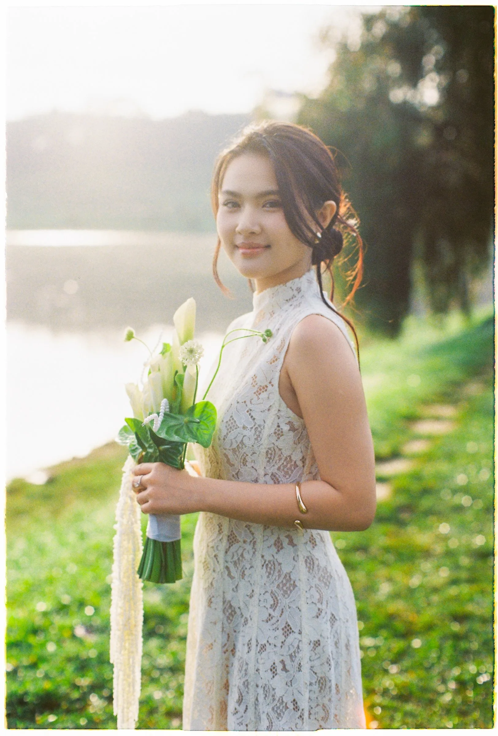 Film portrait of the bride by a misty lake at a Da Lat pre-wedding