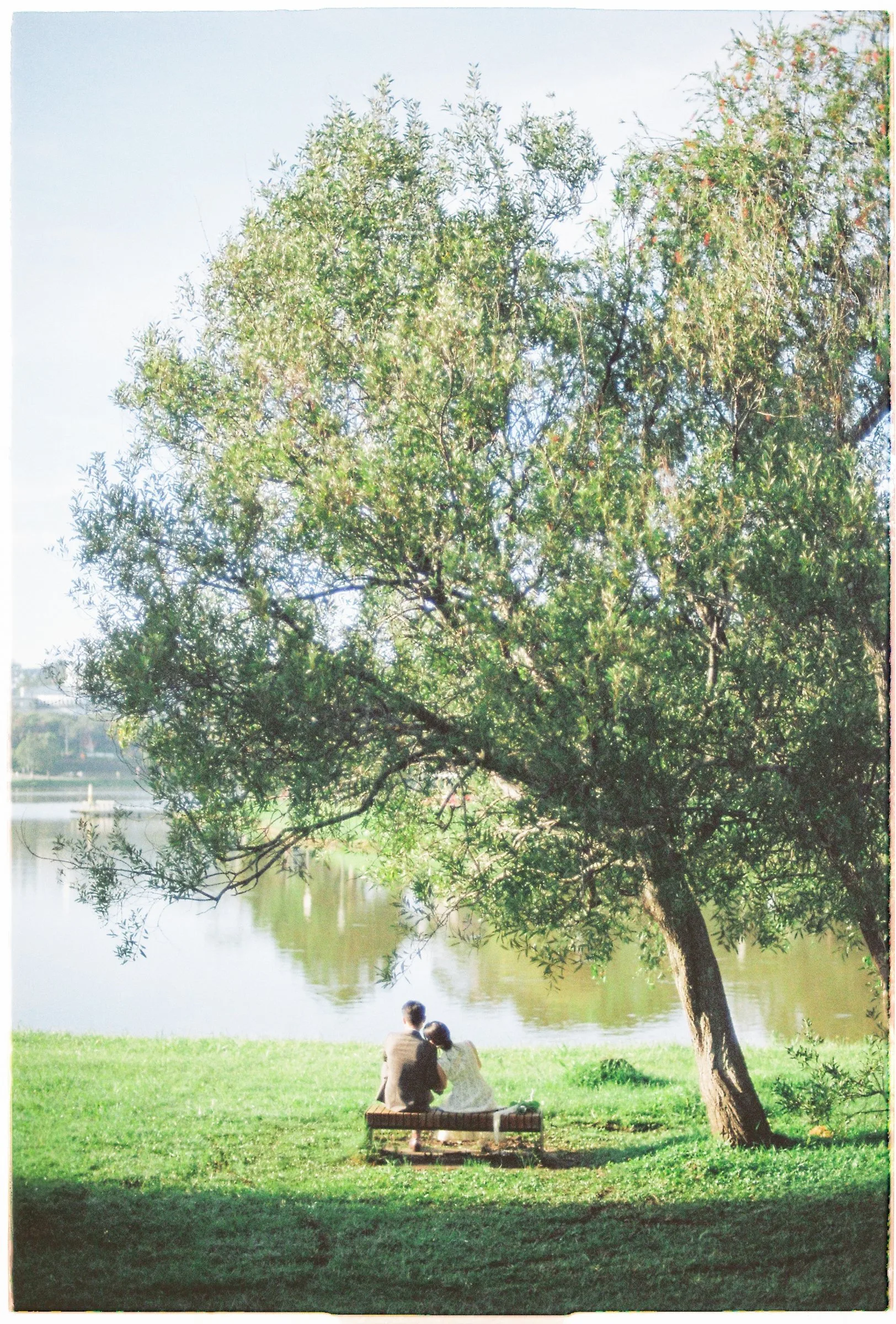 A quiet lakeside moment at a Da Lat pre-wedding on film, in Vietnam's cool highlands.