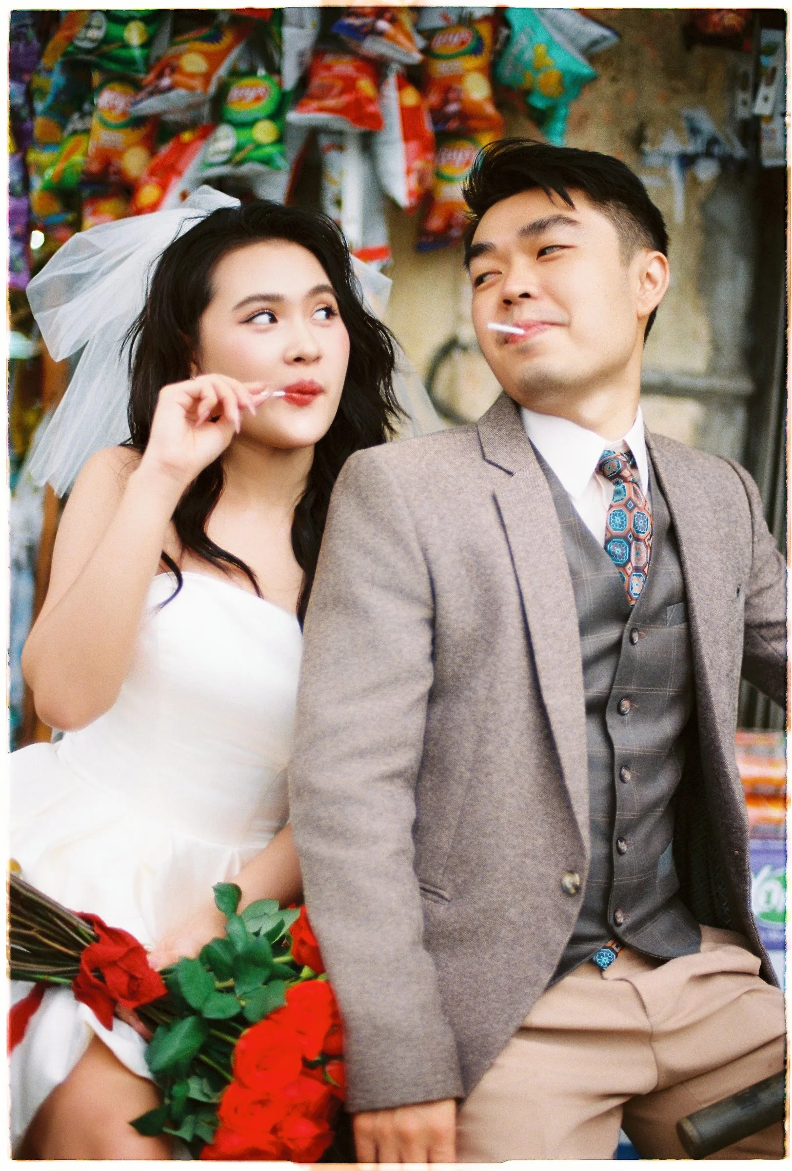 Playful couple at a little Da Lat shop during a film pre-wedding