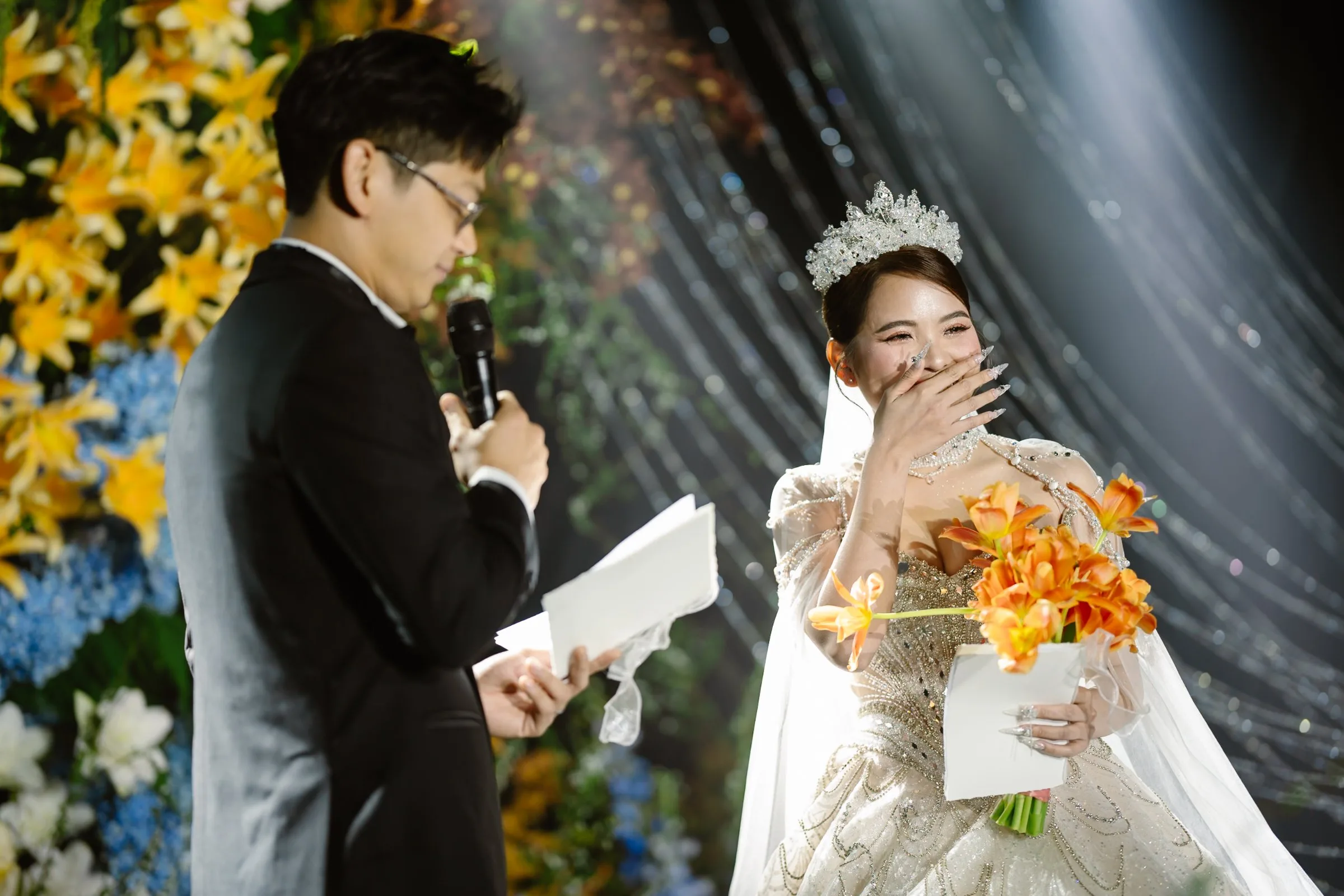 Emotional bride during the vows at a glamorous Da Nang evening wedding