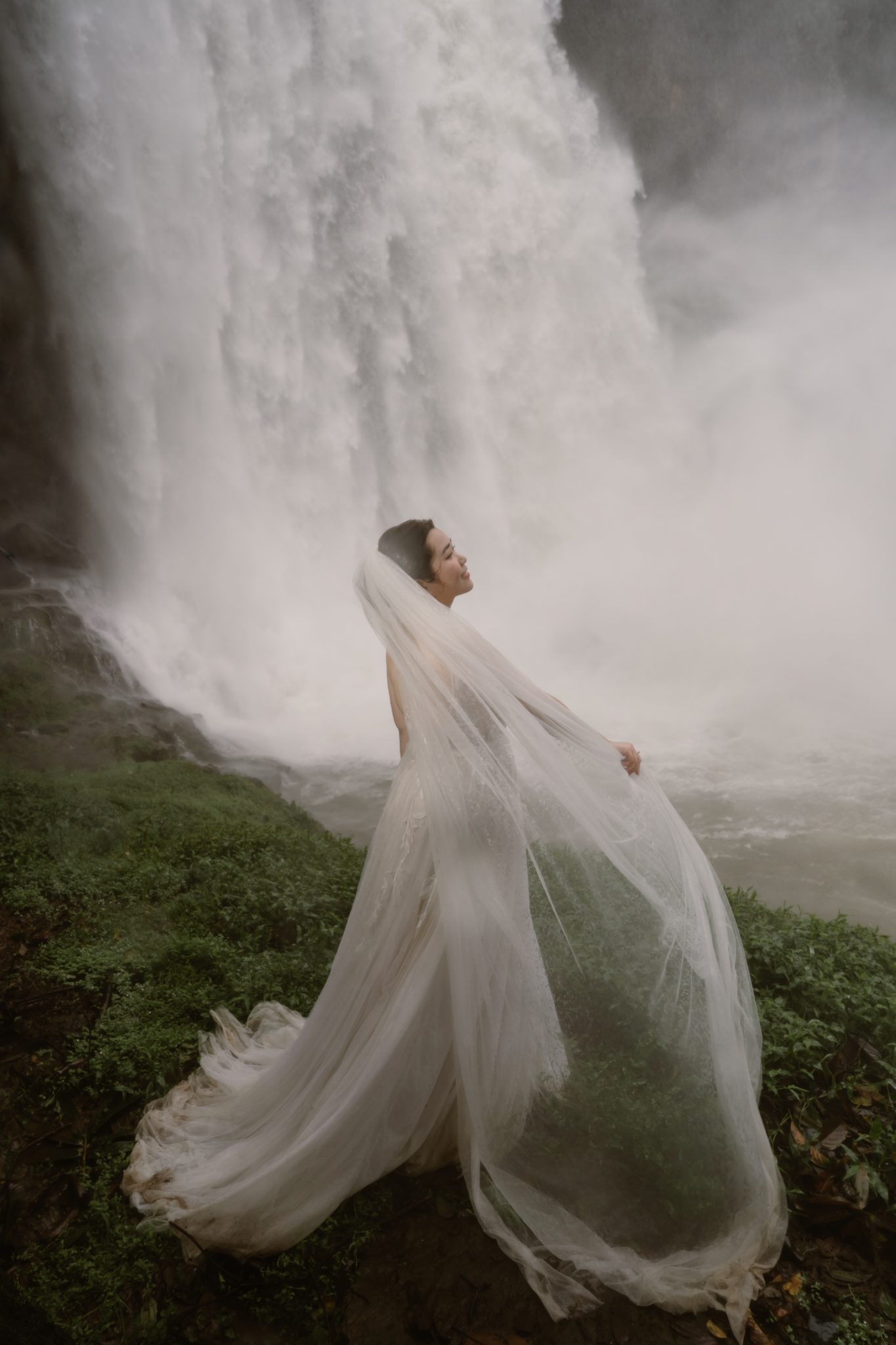 The veil lifting in the wind and waterfall spray, one of our favourite frames of the day.