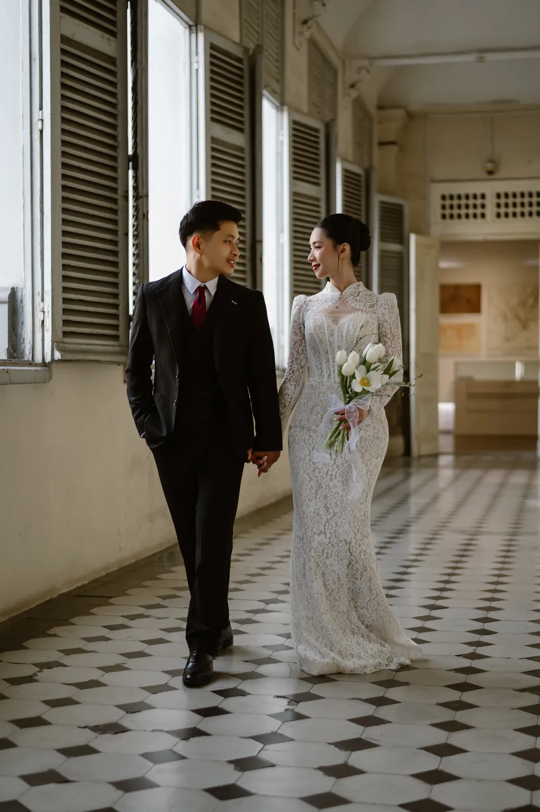 Hiếu and Phát in the colonnade of the Ho Chi Minh City Museum