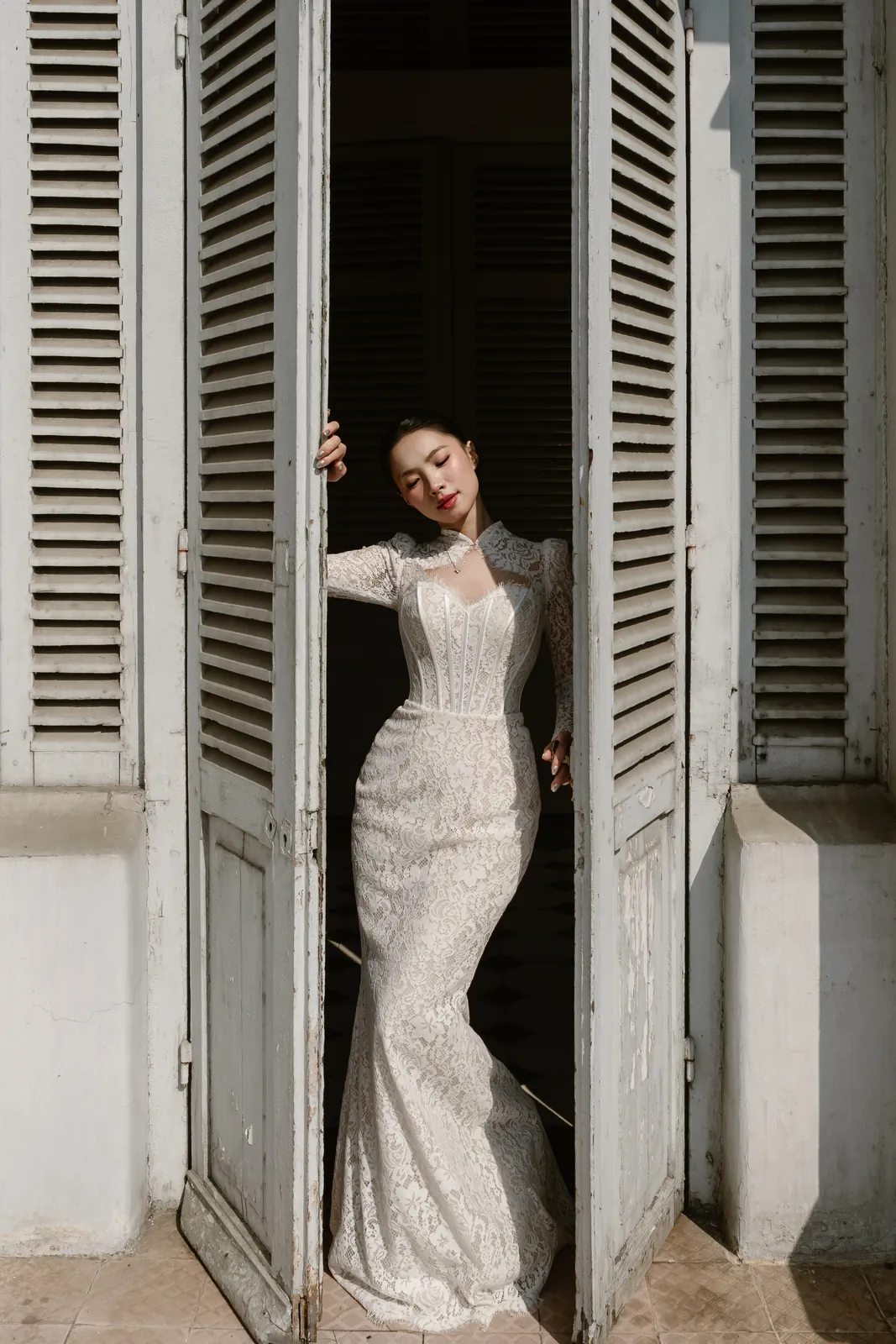 Framed by the museum's tall louvered doors