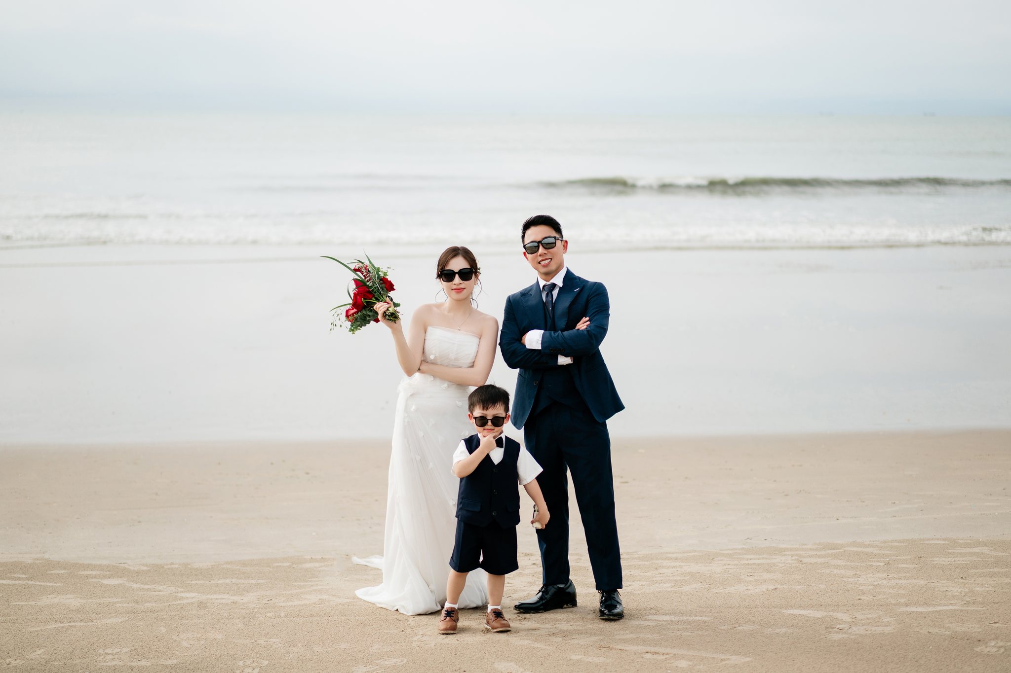 On the sand at Melia Ho Tram, the resort's long jetty behind them.