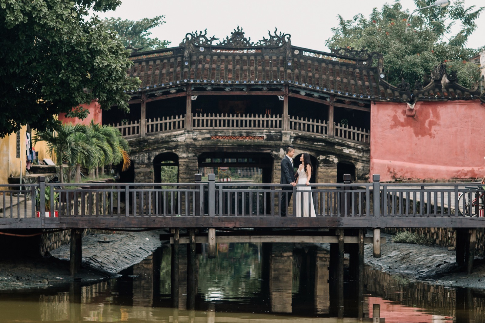 On the footbridge in front of Chua Cau by day.