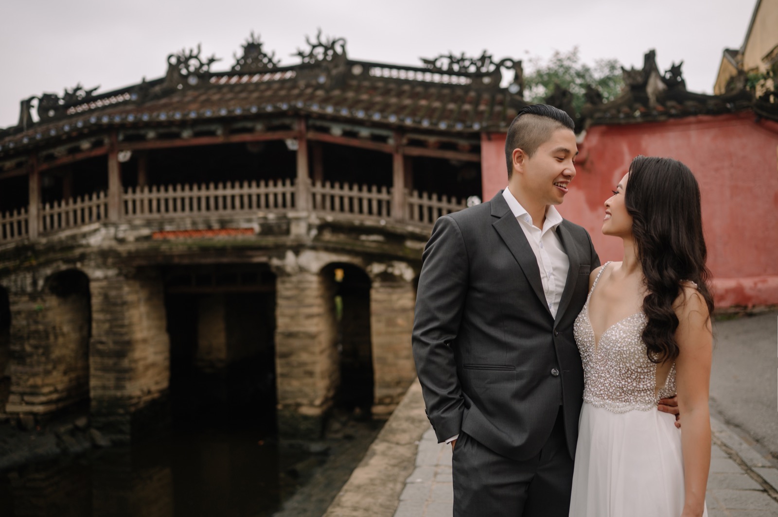 Just the two of them, laughing, by the Japanese Covered Bridge.
