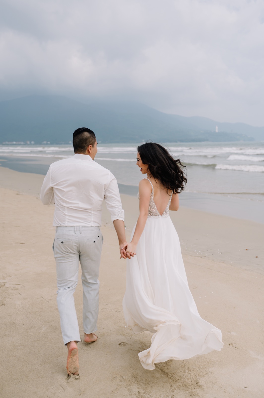 Barefoot on the sand as the Da Nang coast opened up in front of them.