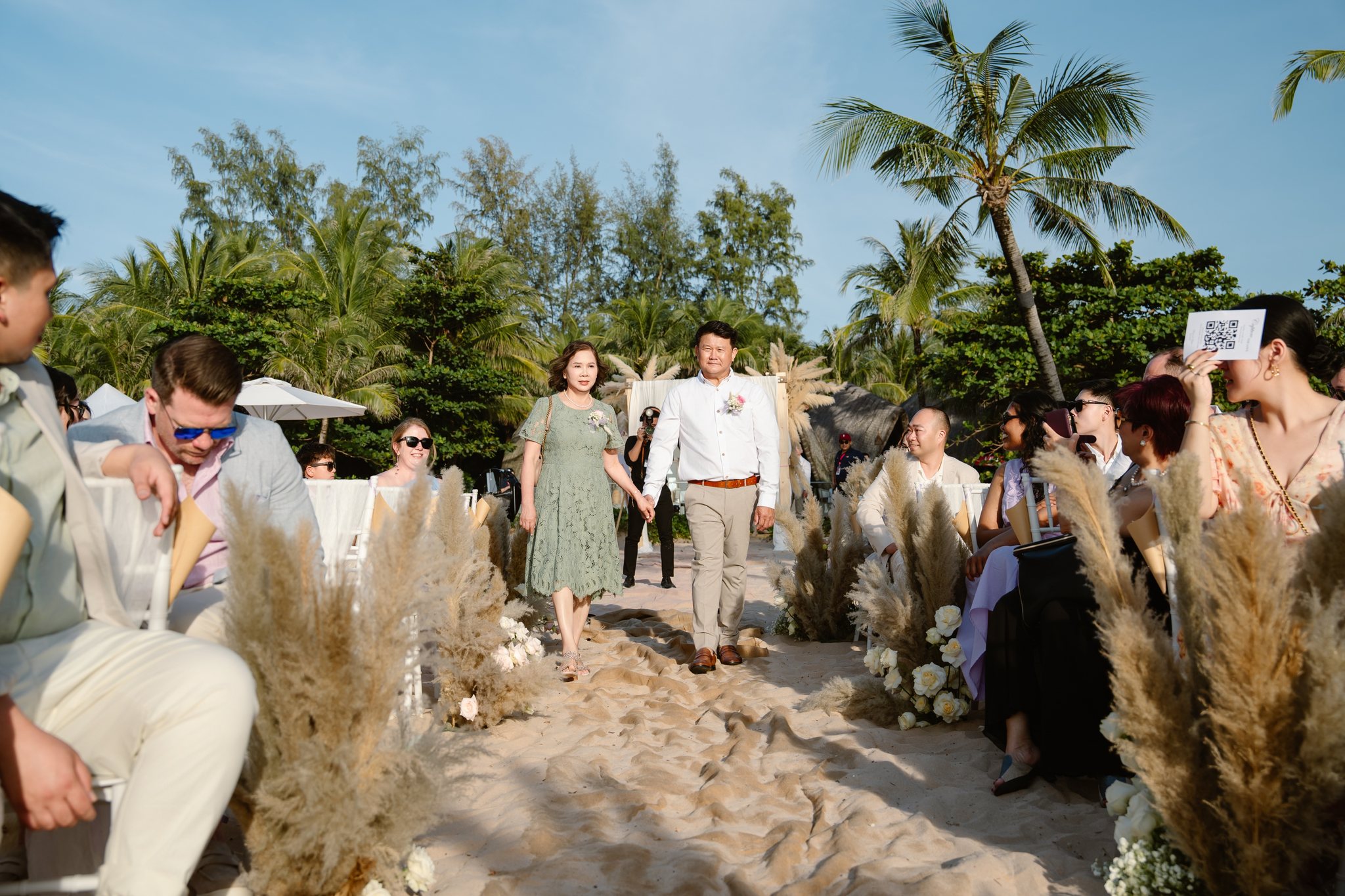 A pampas-lined aisle leading down to the sea.