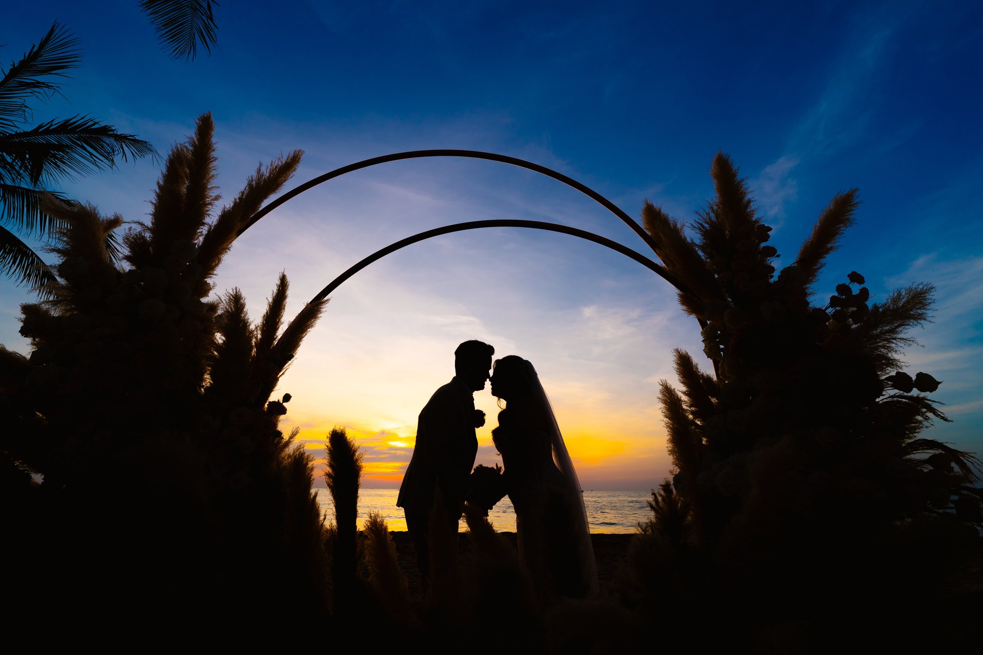 A kiss under the arch as the sun went down.