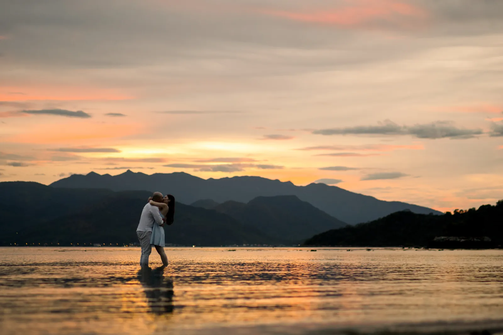 A red sunset pre-wedding on the water in Nha Trang