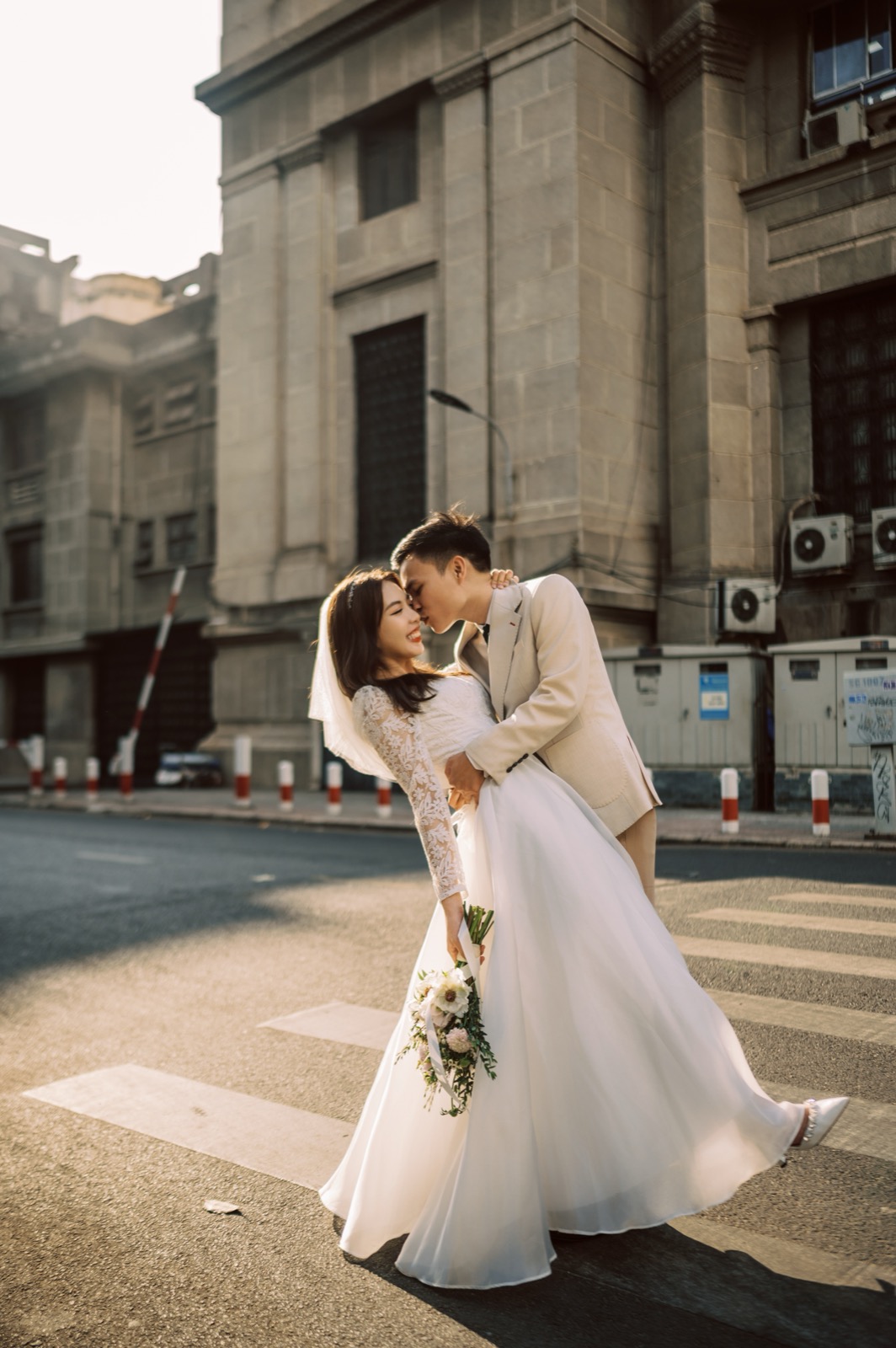 A stolen kiss on a classic District 1 street corner.