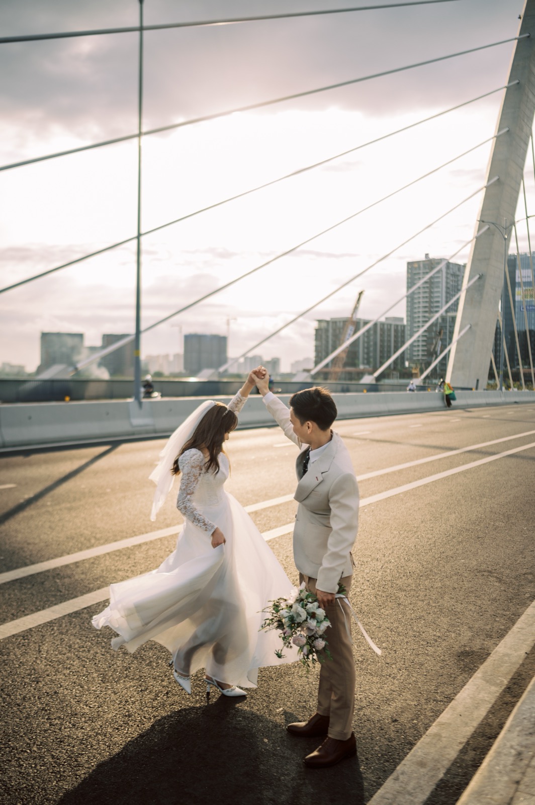 A twirl and a bouquet on the bridge.