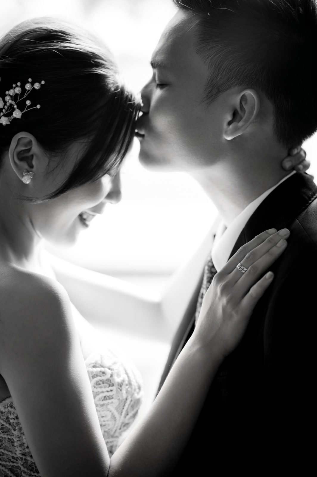 A tender forehead kiss.