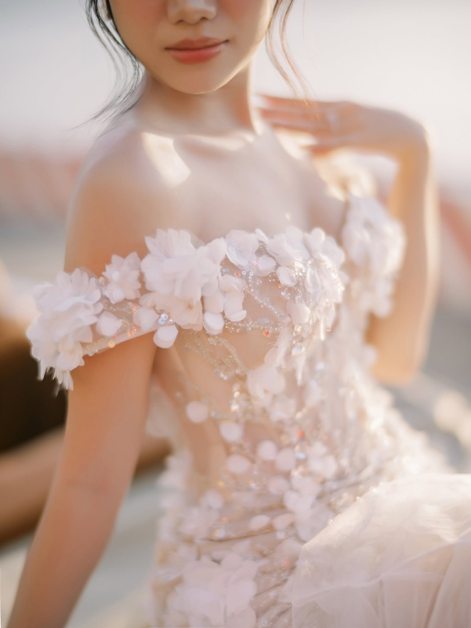 Soft light on the neckline of the dress.