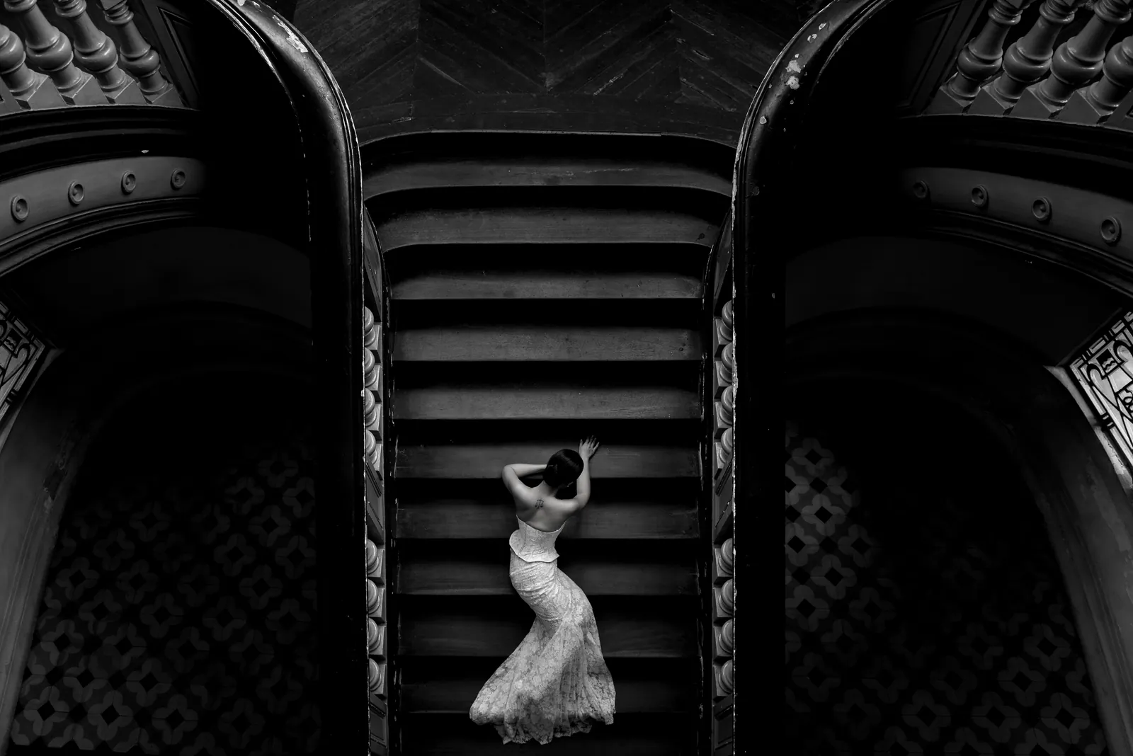 The grand double staircase at the Museum of Ho Chi Minh City.