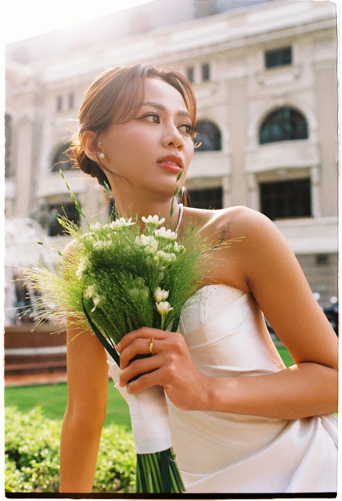 Bridal portrait on film outside the Saigon Opera House