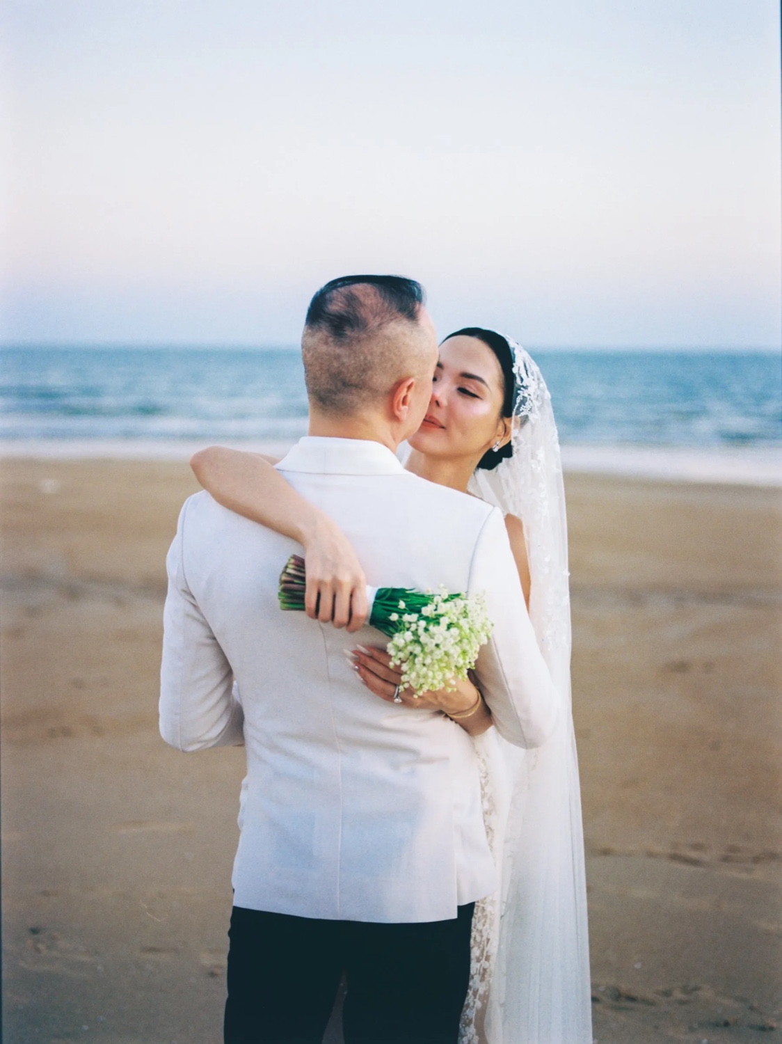 Golden-hour beach wedding ceremony in Vietnam by TIMO Wedding