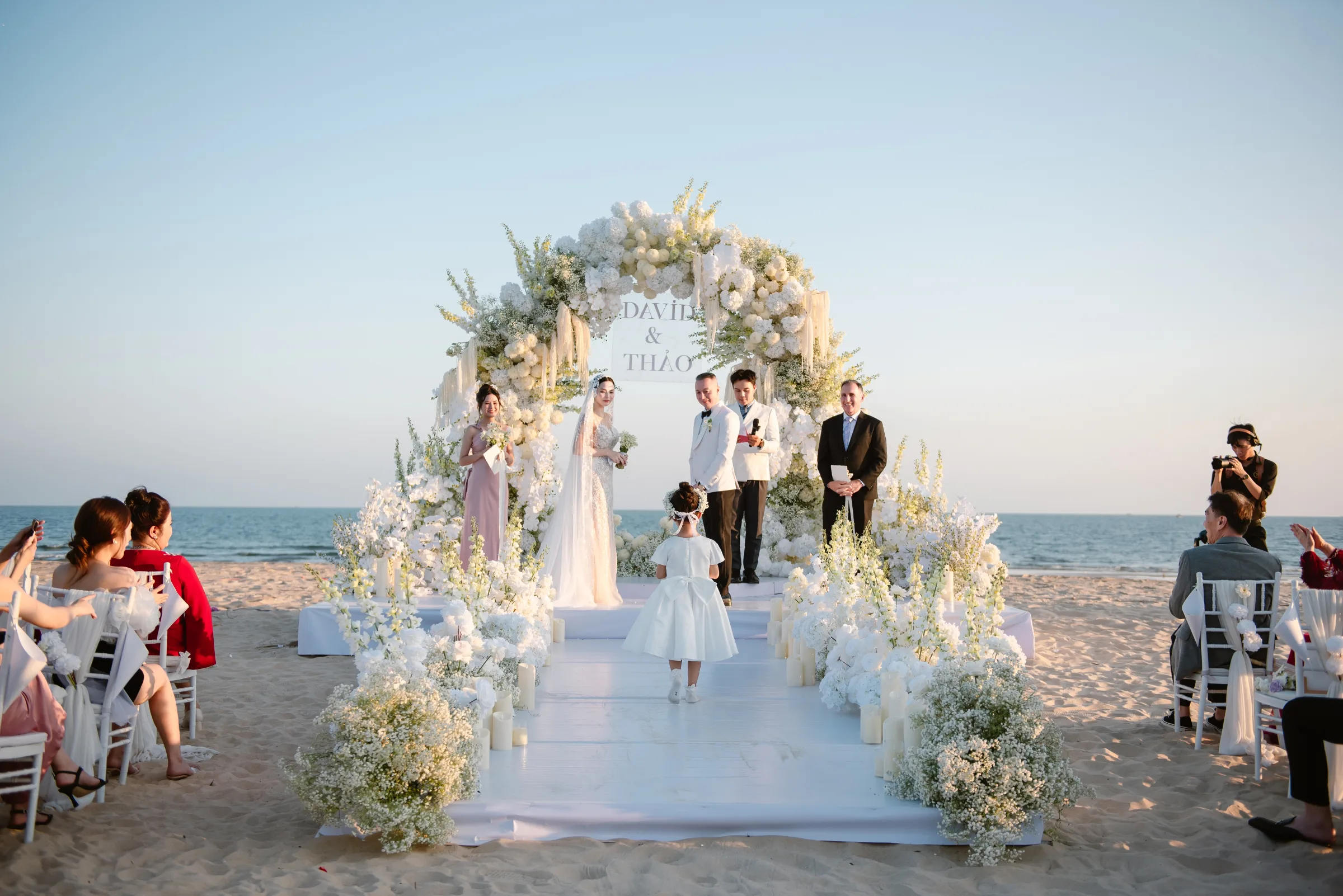 An intimate ceremony on the beach at Meliá Hồ Tràm, just steps from the sea.