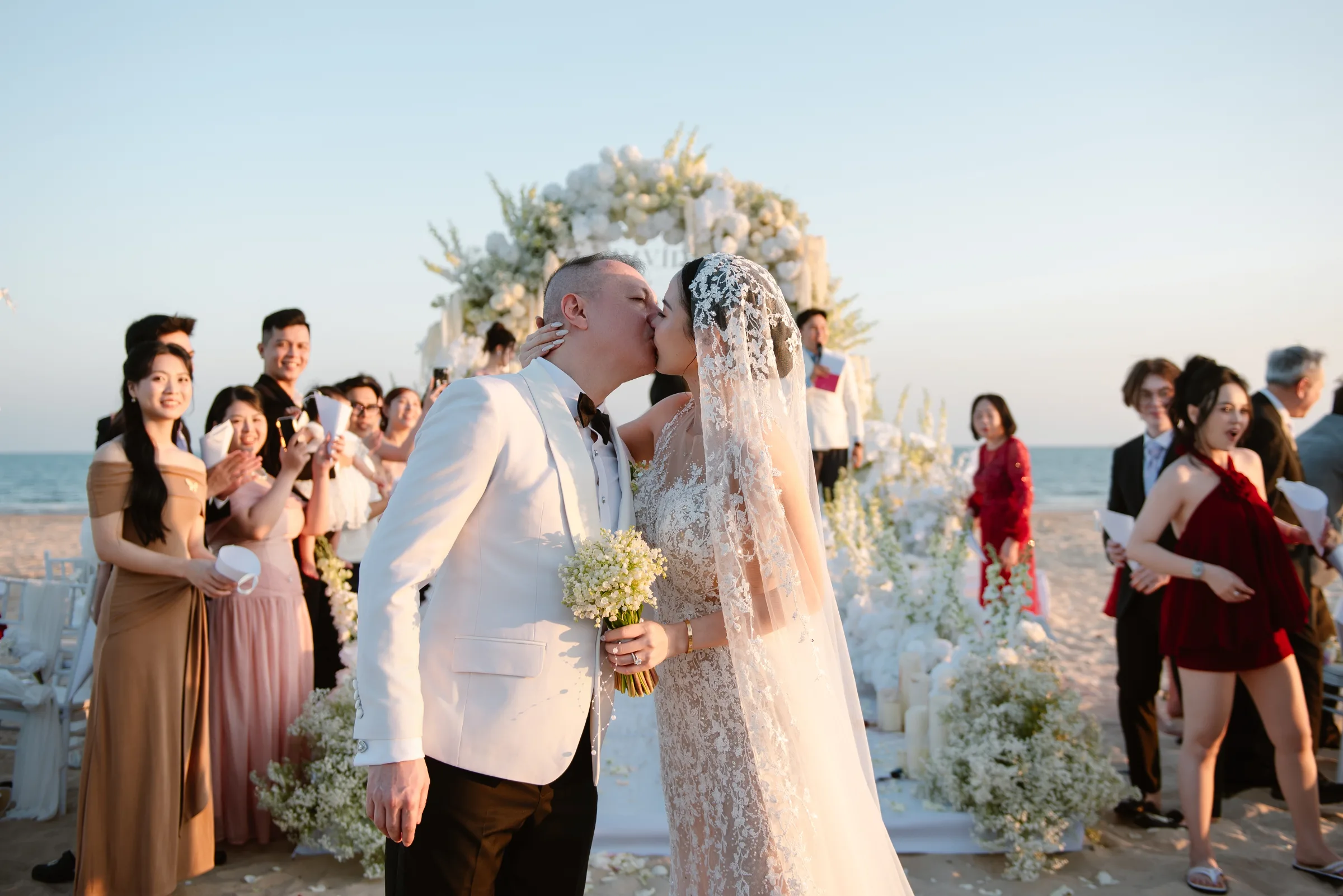 Newlyweds, walking back to the cheers of everyone they love.