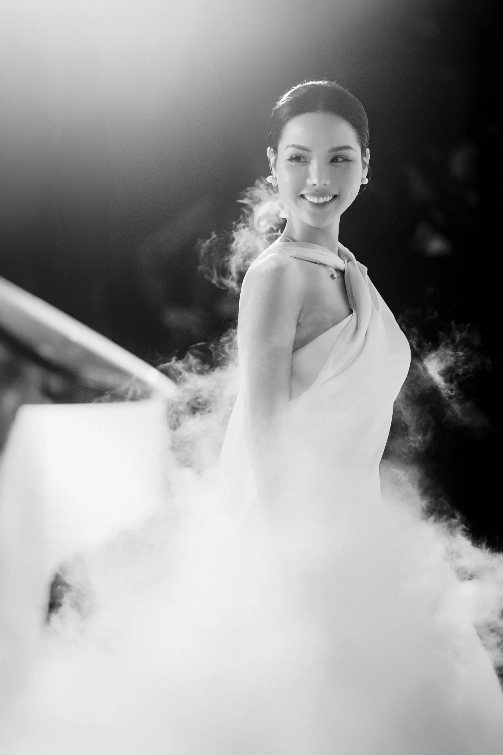 Black and white portrait of the bride in soft haze at a Ho Tram wedding reception