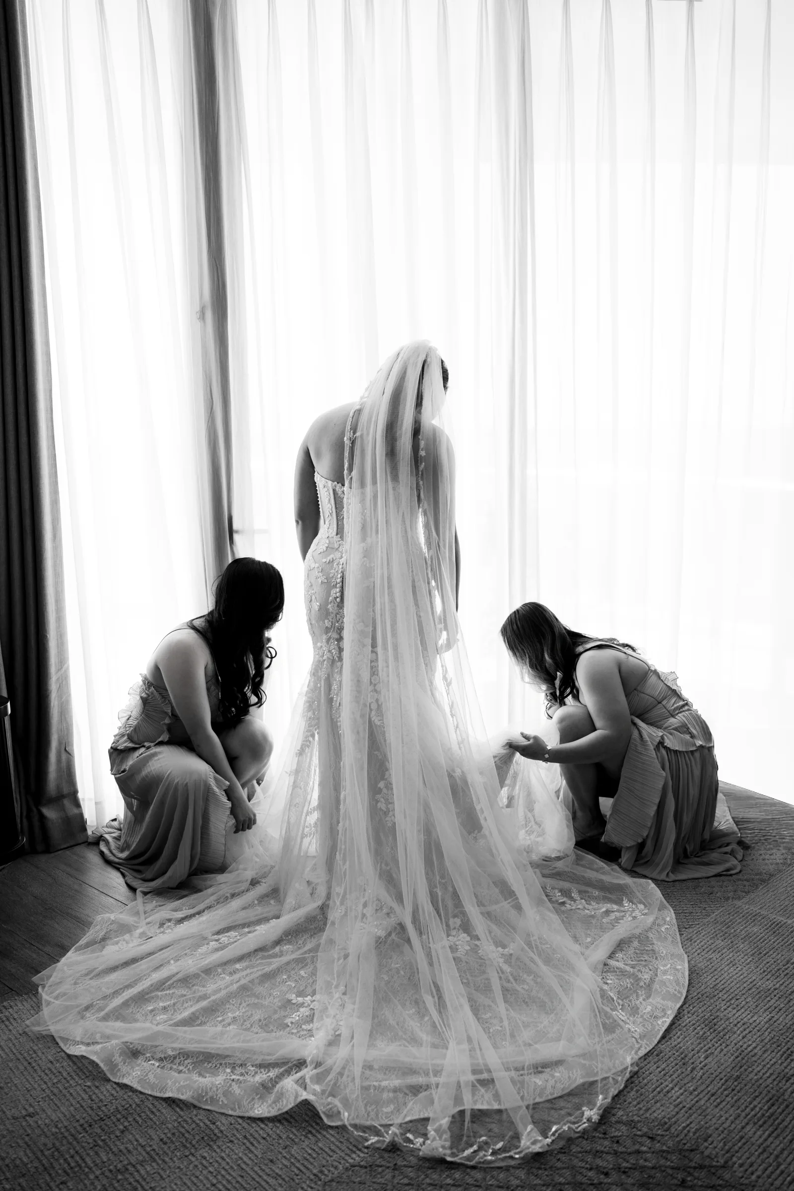 Black and white portrait of the bride and her long veil at InterContinental Phu Quoc