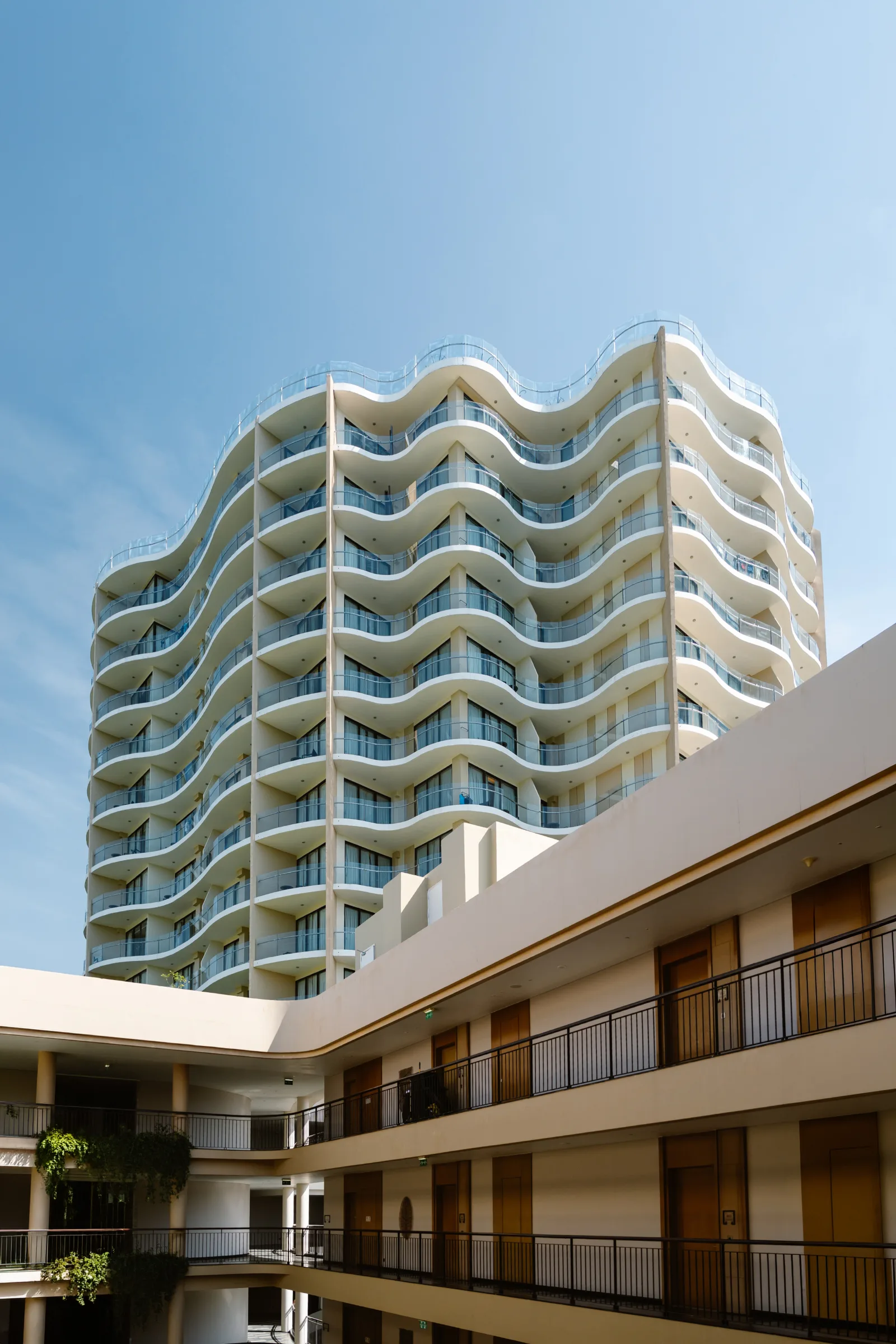 Architecture of the InterContinental Phu Quoc resort against a bright sky
