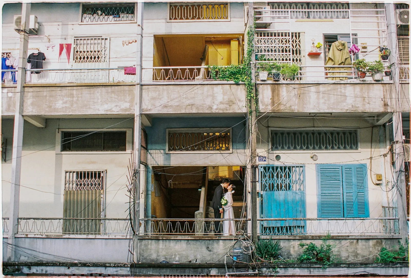 A Saigon Film Pre-Wedding in Three Looks: Áo Dài, Cheongsam and a European Rooftop | Ngọc & Phong