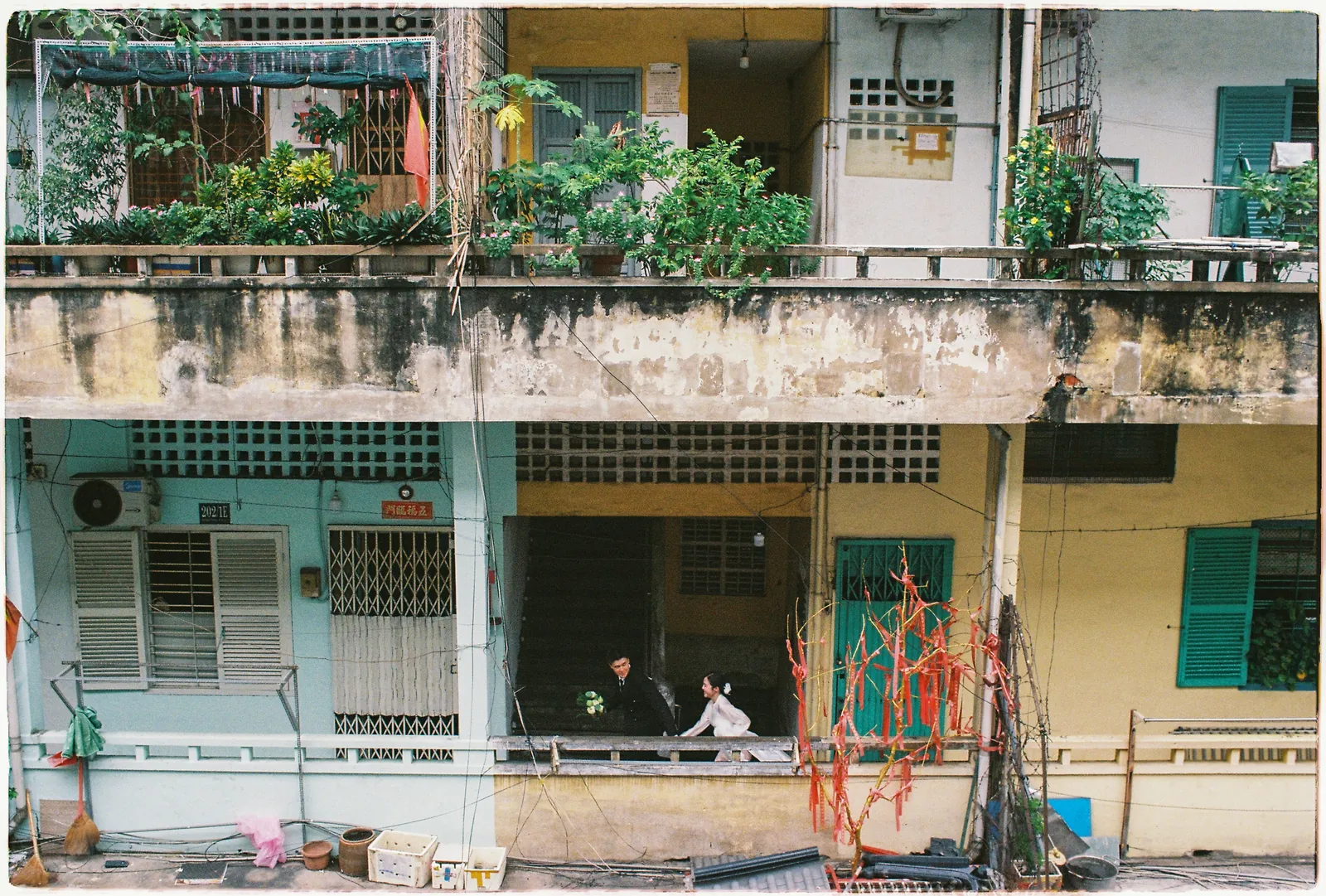 A Saigon Film Pre-Wedding in Three Looks: Áo Dài, Cheongsam and a European Rooftop | Ngọc & Phong