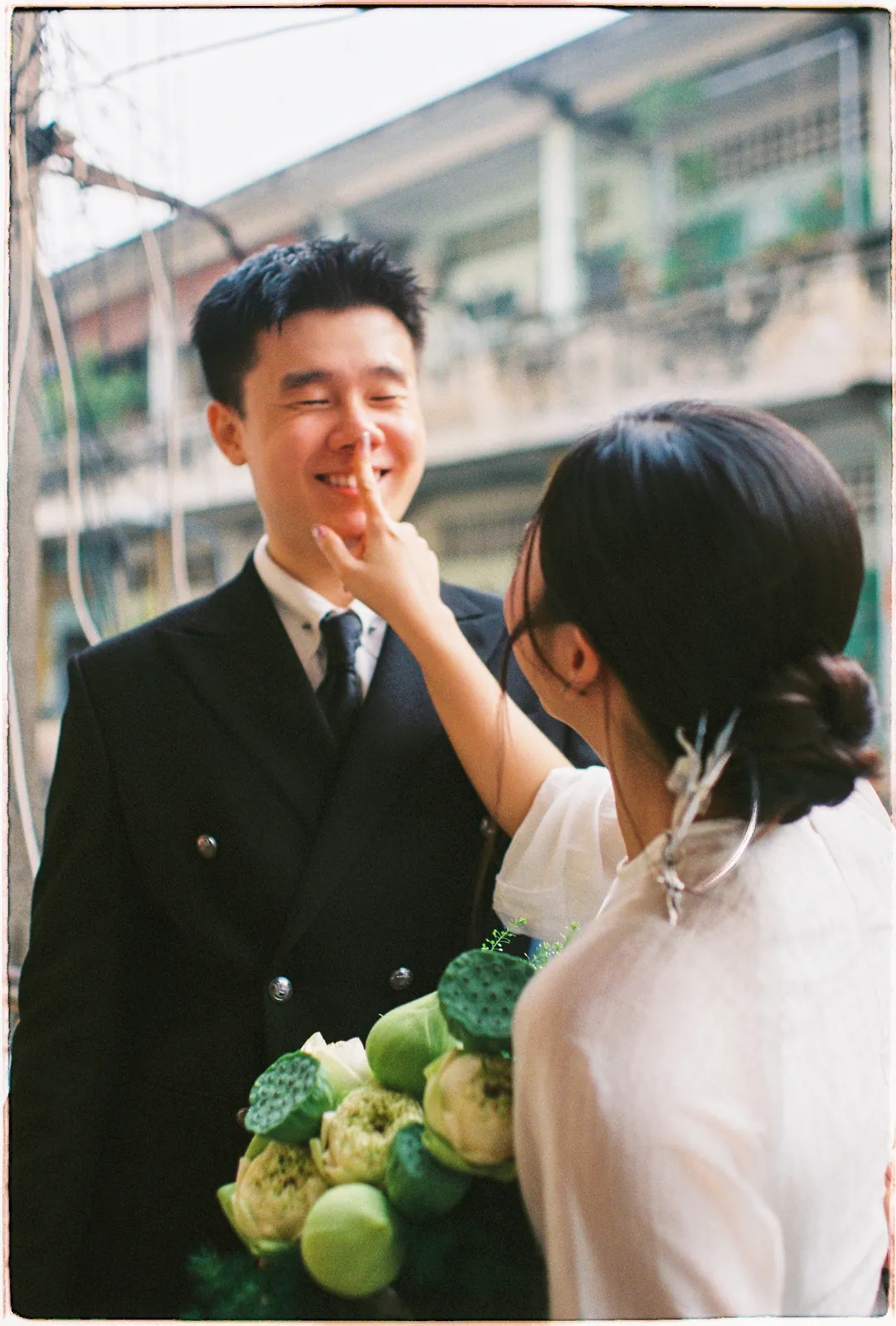 A Saigon Film Pre-Wedding in Three Looks: Áo Dài, Cheongsam and a European Rooftop | Ngọc & Phong