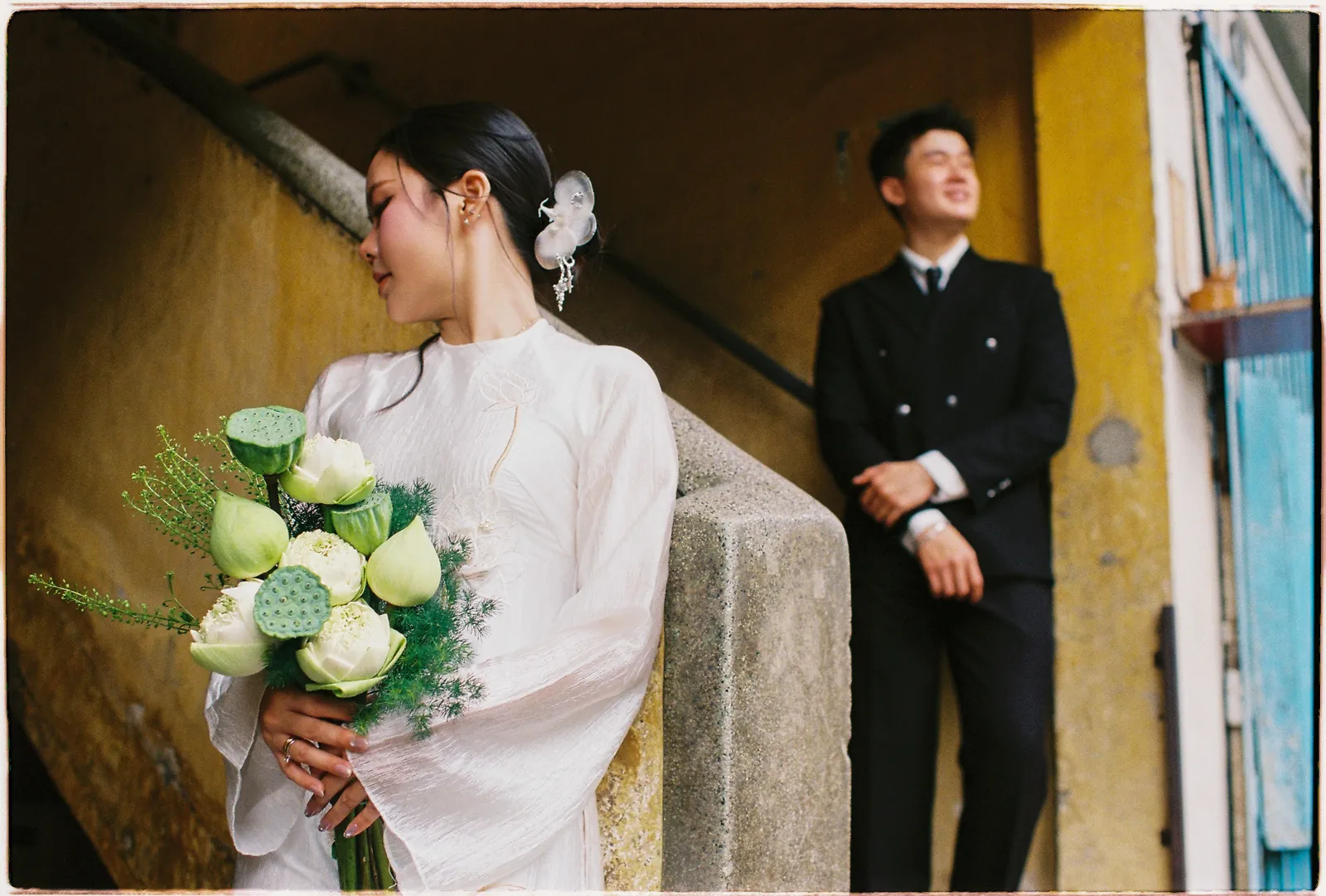 A Saigon Film Pre-Wedding in Three Looks: Áo Dài, Cheongsam and a European Rooftop | Ngọc & Phong