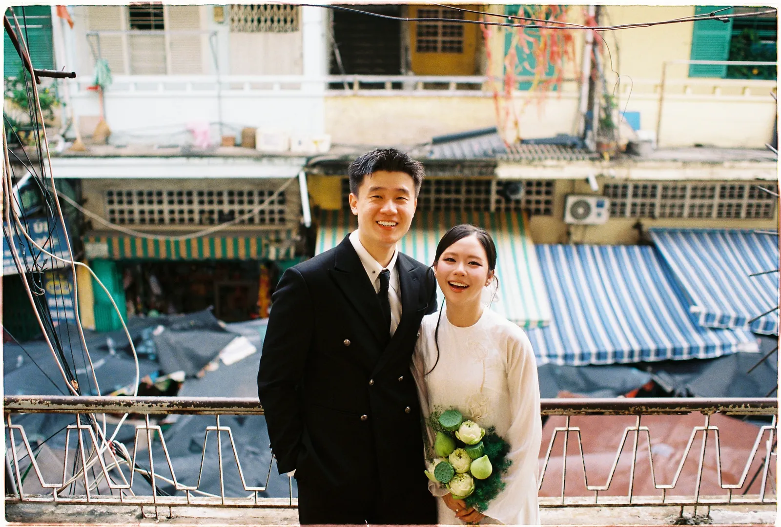 A Saigon Film Pre-Wedding in Three Looks: Áo Dài, Cheongsam and a European Rooftop | Ngọc & Phong