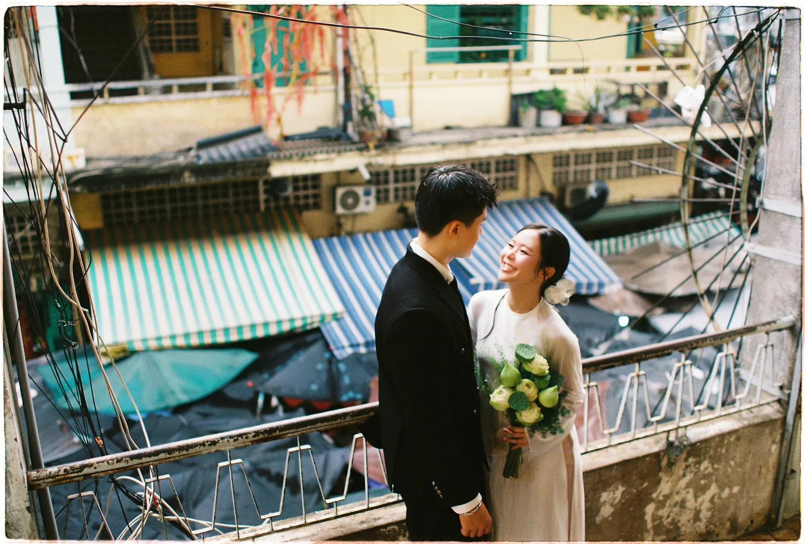 A Saigon Film Pre-Wedding in Three Looks: Áo Dài, Cheongsam and a European Rooftop | Ngọc & Phong