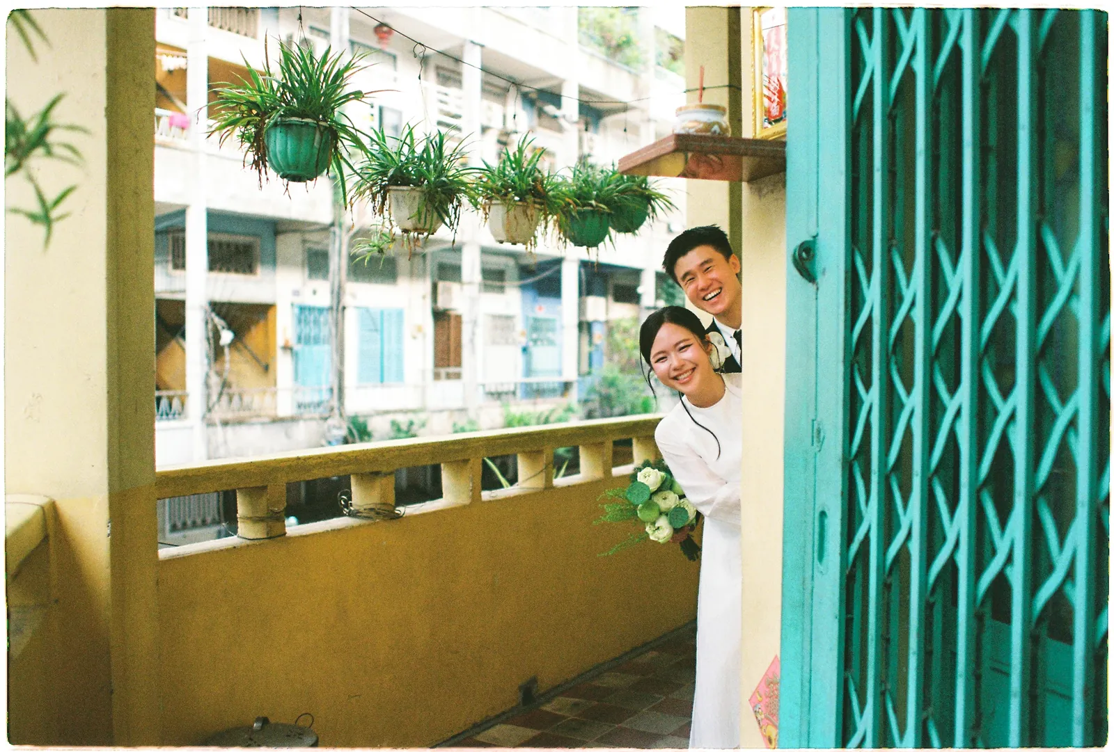 A Saigon Film Pre-Wedding in Three Looks: Áo Dài, Cheongsam and a European Rooftop | Ngọc & Phong