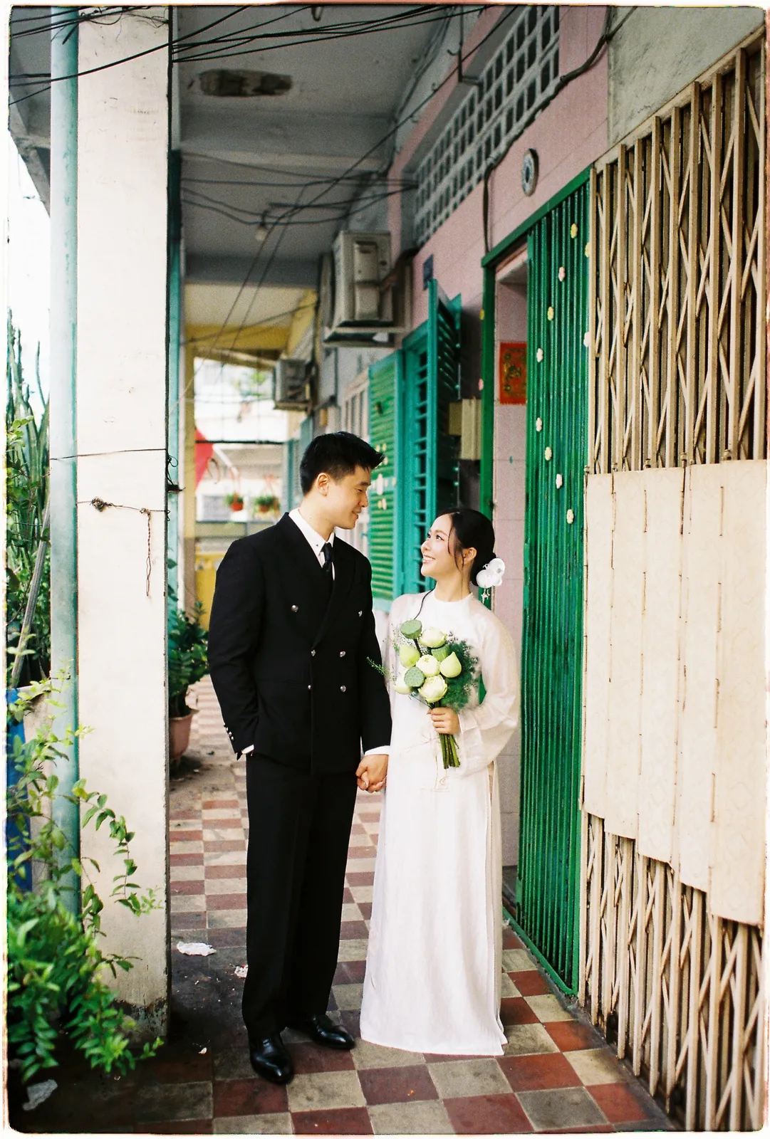 A Saigon Film Pre-Wedding in Three Looks: Áo Dài, Cheongsam and a European Rooftop | Ngọc & Phong