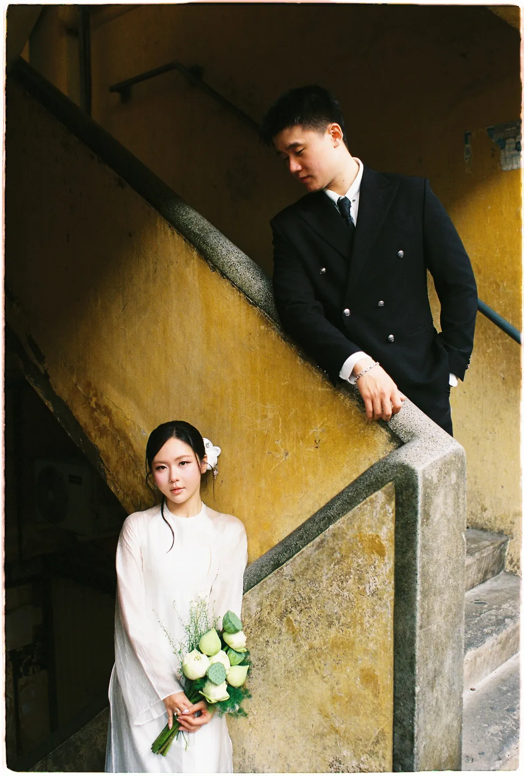 A Saigon Film Pre-Wedding in Three Looks: Áo Dài, Cheongsam and a European Rooftop | Ngọc & Phong