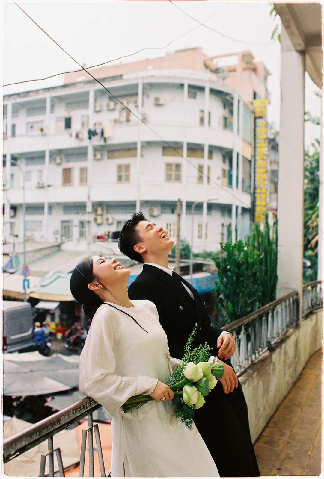 A Saigon Film Pre-Wedding in Three Looks: Áo Dài, Cheongsam and a European Rooftop | Ngọc & Phong