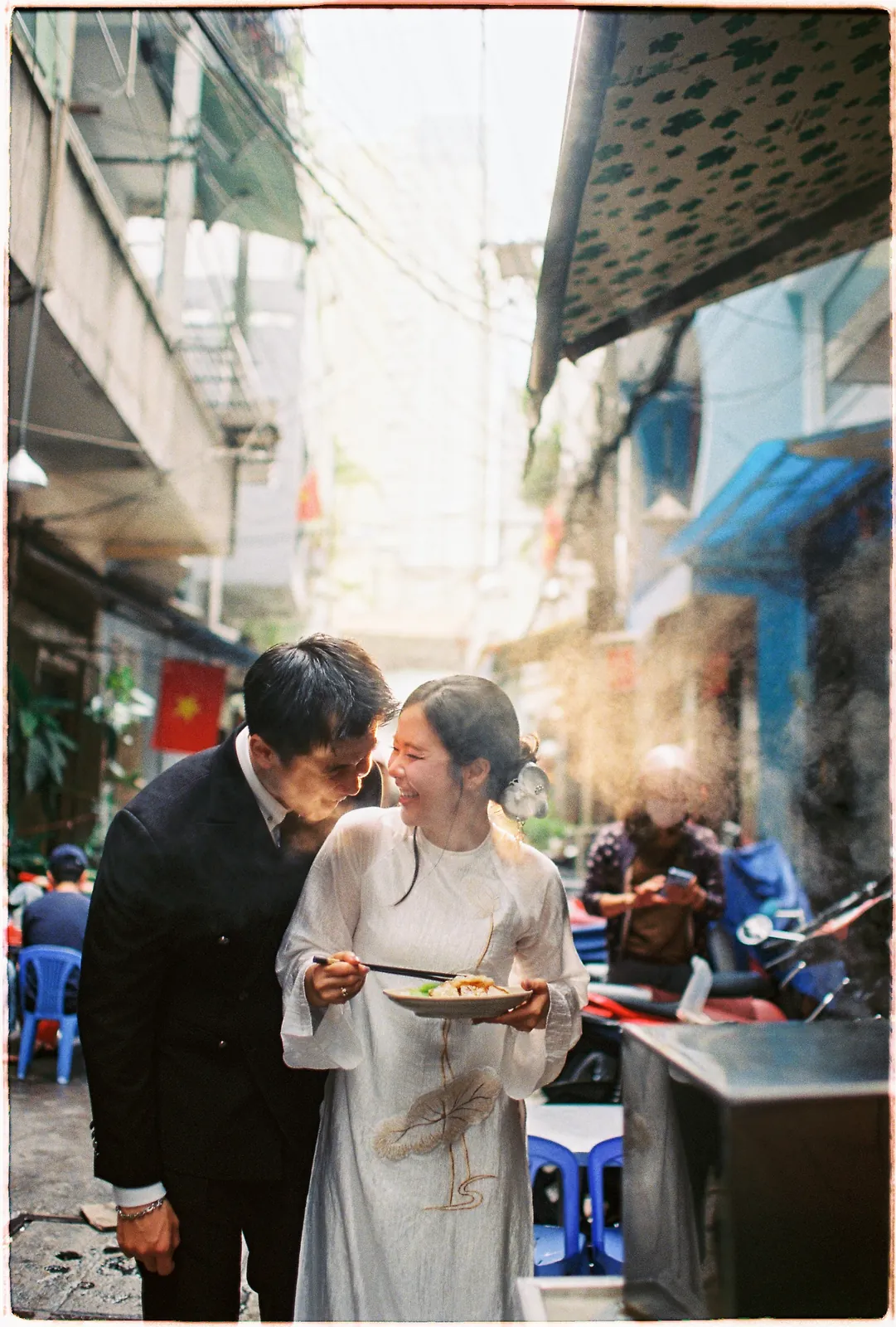 A Saigon Film Pre-Wedding in Three Looks: Áo Dài, Cheongsam and a European Rooftop | Ngọc & Phong