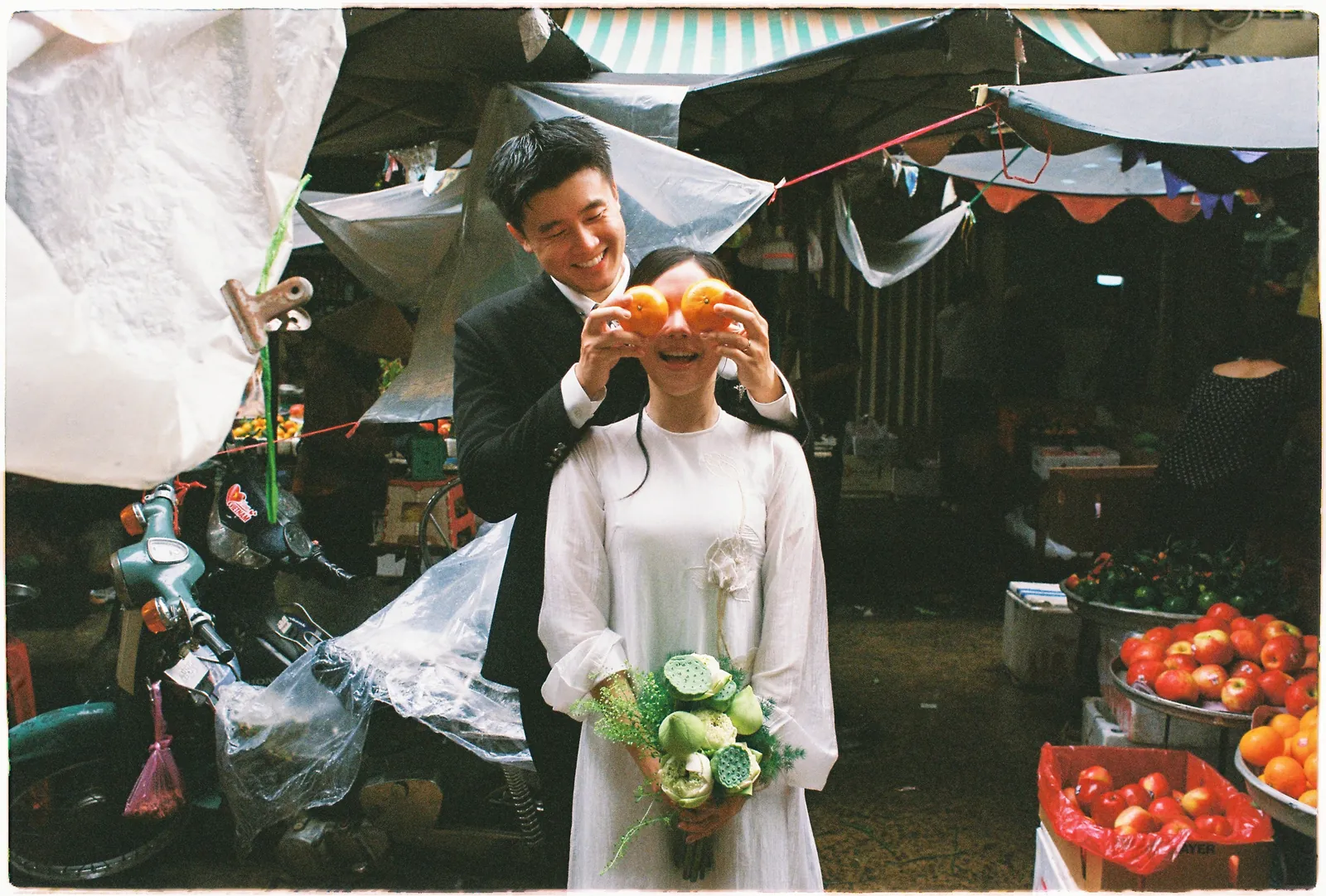 A Saigon Film Pre-Wedding in Three Looks: Áo Dài, Cheongsam and a European Rooftop | Ngọc & Phong