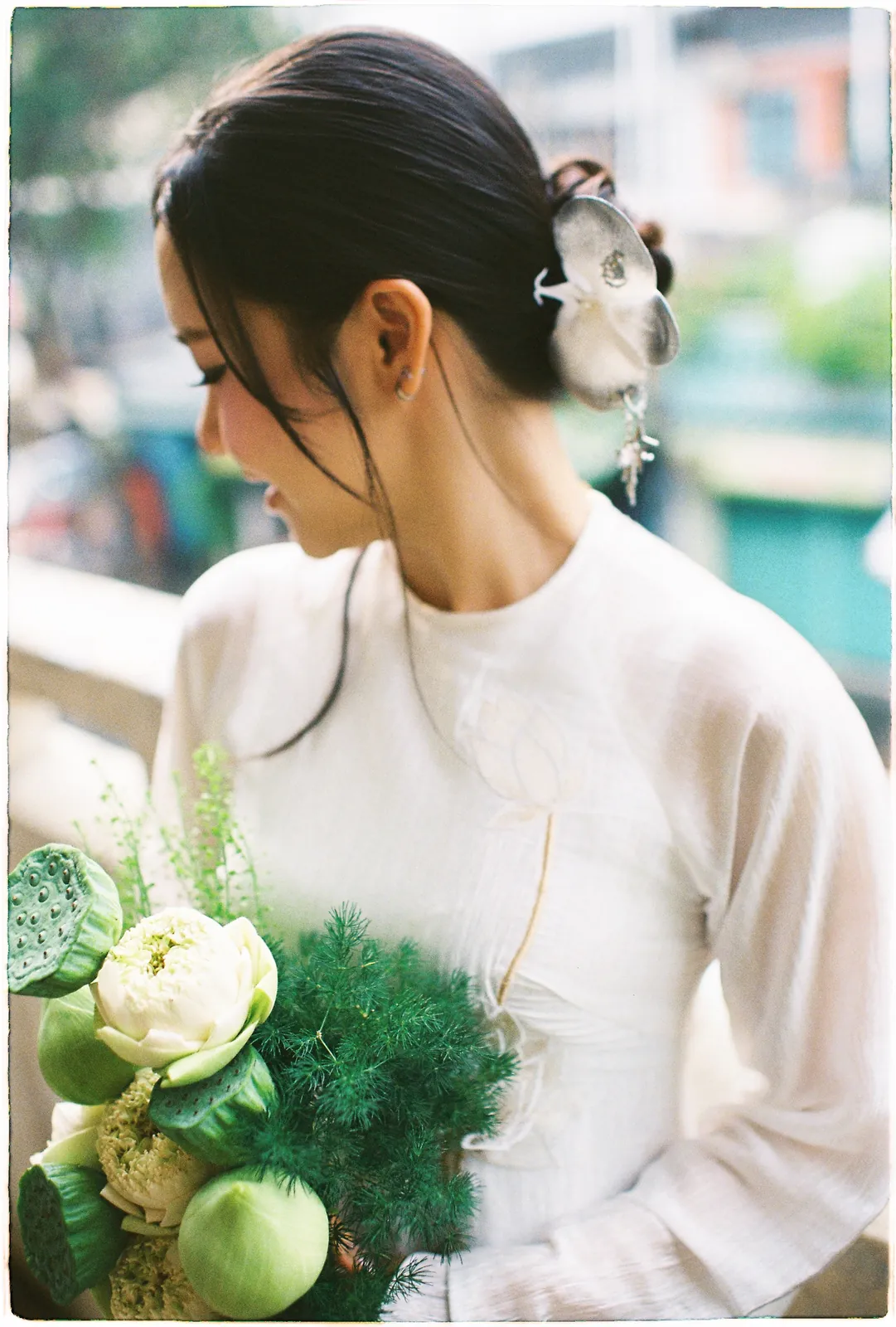 A Saigon Film Pre-Wedding in Three Looks: Áo Dài, Cheongsam and a European Rooftop | Ngọc & Phong