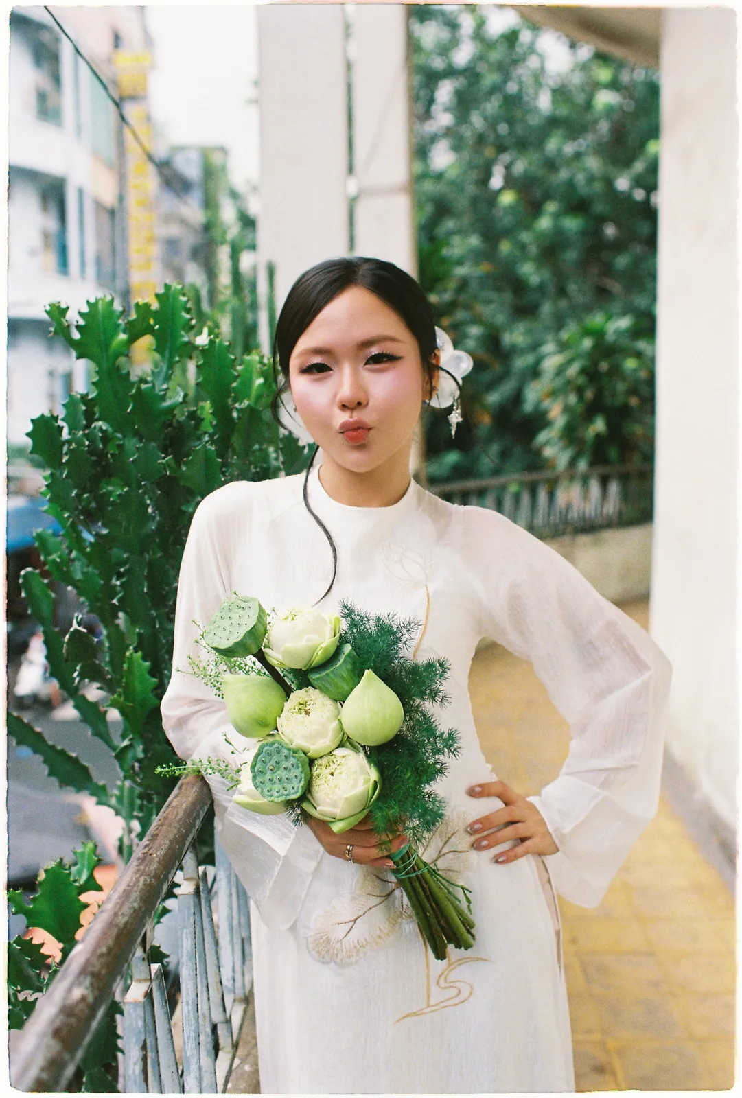 A Saigon Film Pre-Wedding in Three Looks: Áo Dài, Cheongsam and a European Rooftop | Ngọc & Phong