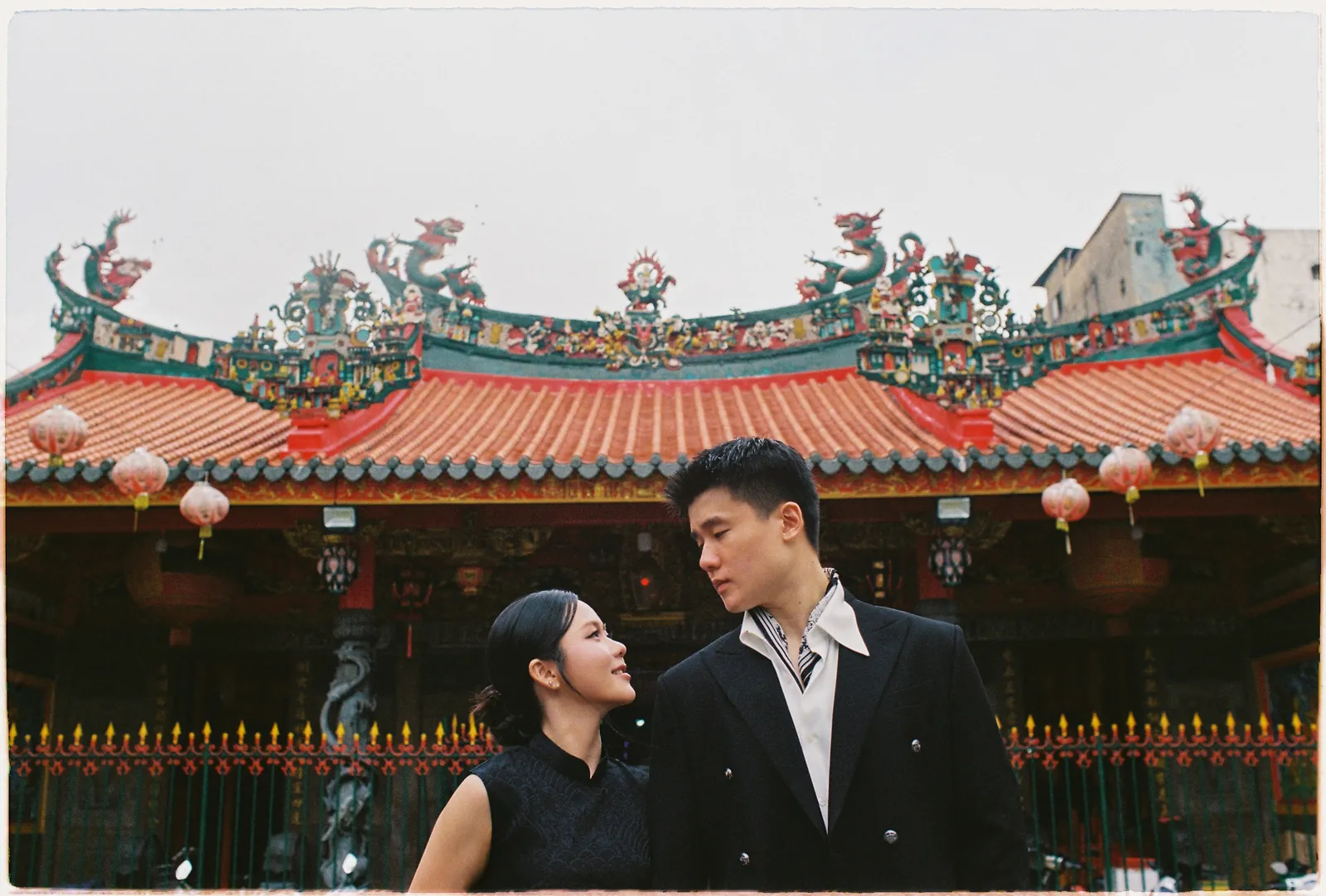 A Saigon Film Pre-Wedding in Three Looks: Áo Dài, Cheongsam and a European Rooftop | Ngọc & Phong