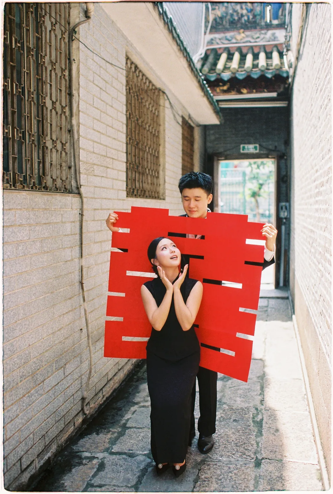 A Saigon Film Pre-Wedding in Three Looks: Áo Dài, Cheongsam and a European Rooftop | Ngọc & Phong