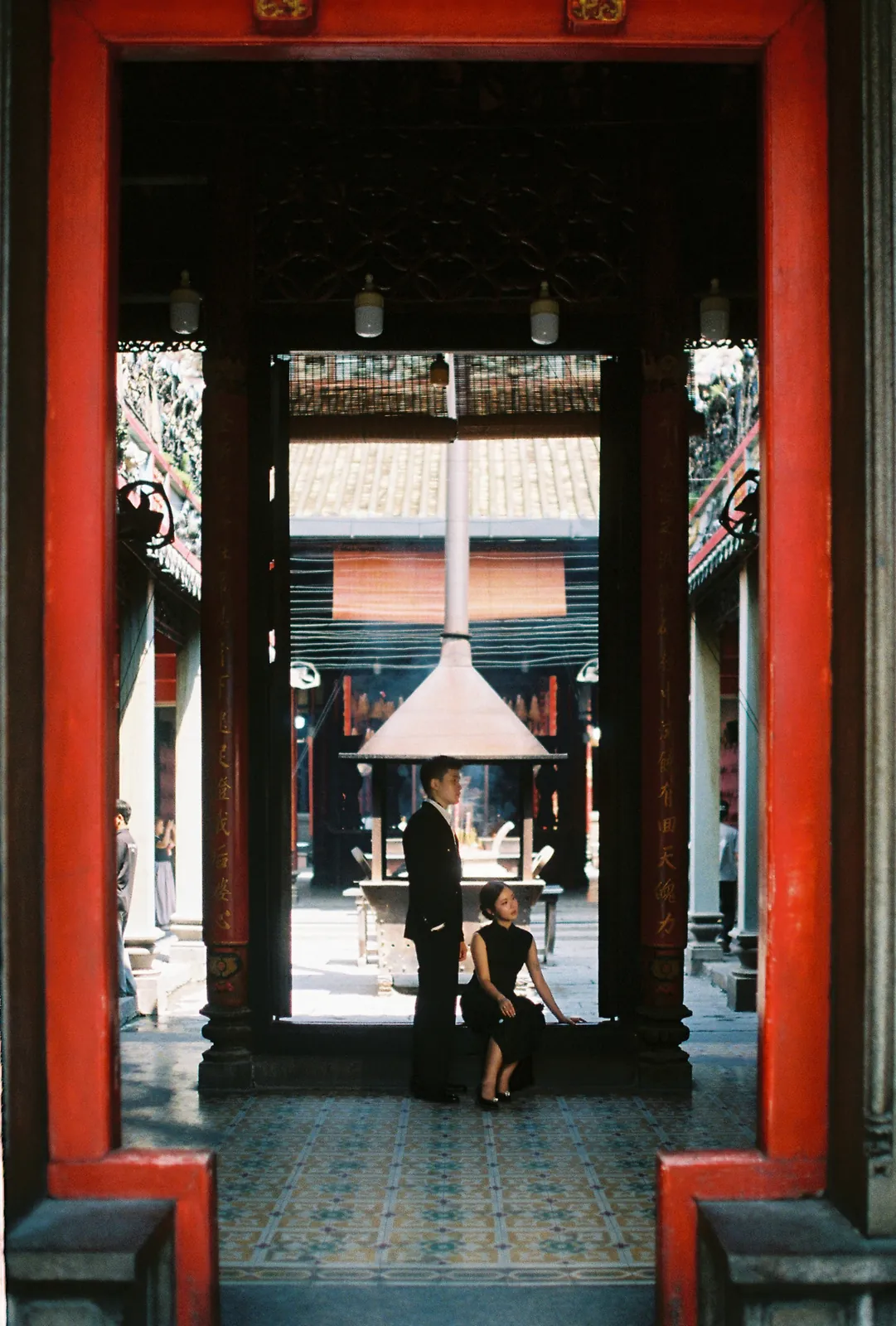 A Saigon Film Pre-Wedding in Three Looks: Áo Dài, Cheongsam and a European Rooftop | Ngọc & Phong