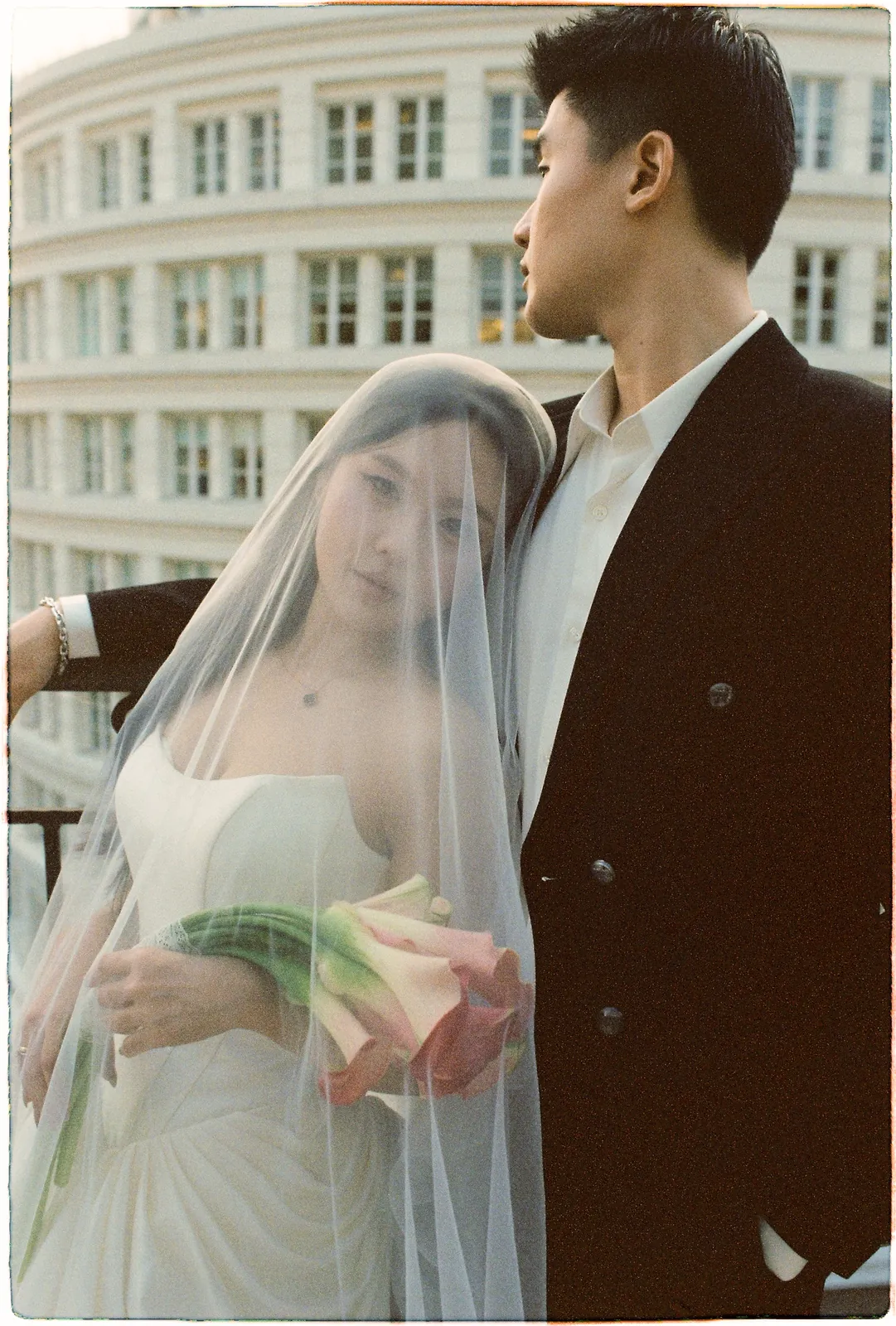 A Saigon Film Pre-Wedding in Three Looks: Áo Dài, Cheongsam and a European Rooftop | Ngọc & Phong