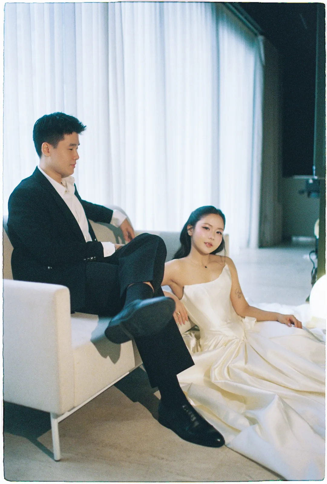 A Saigon Film Pre-Wedding in Three Looks: Áo Dài, Cheongsam and a European Rooftop | Ngọc & Phong
