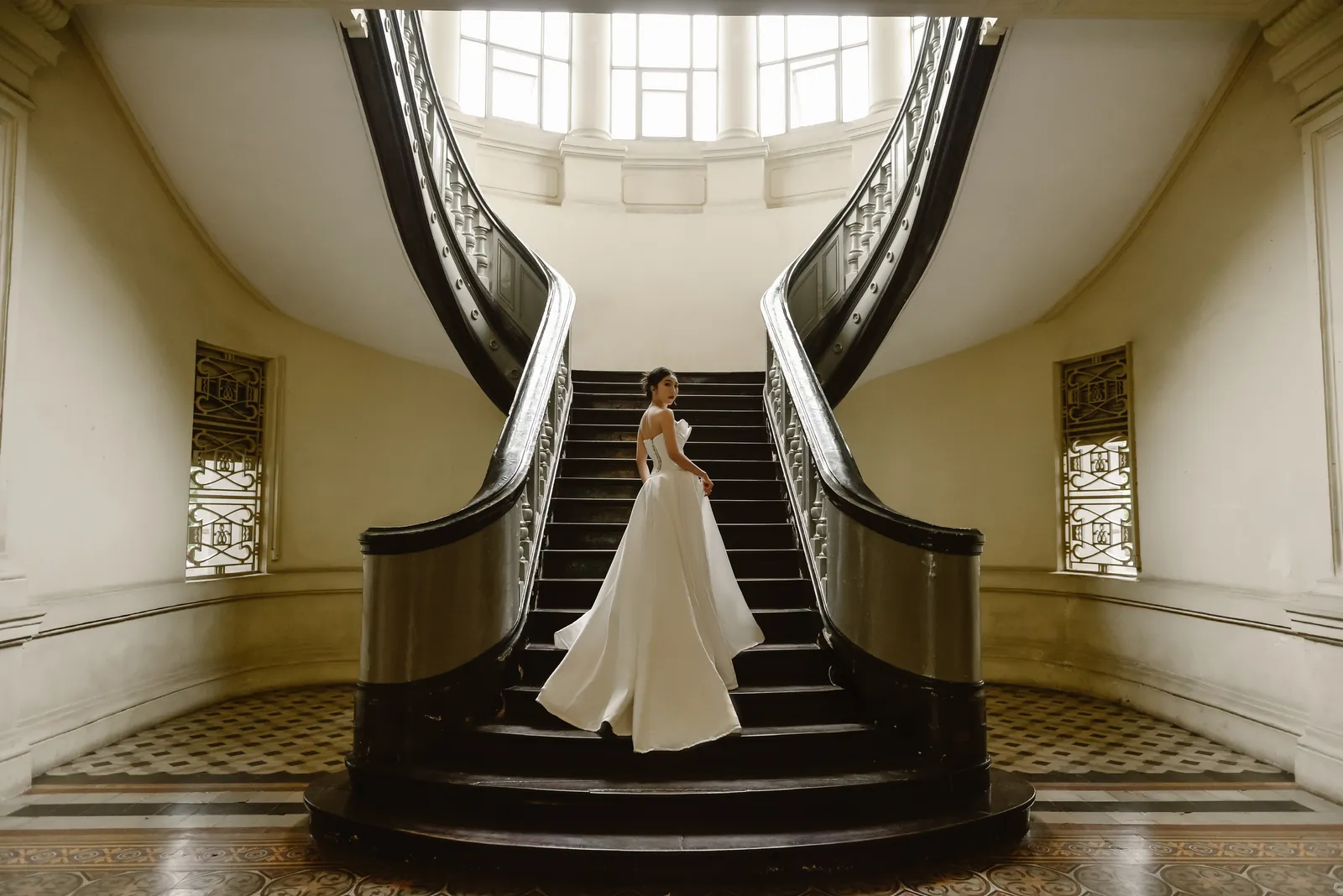 The grand staircase at the Museum of Ho Chi Minh City.